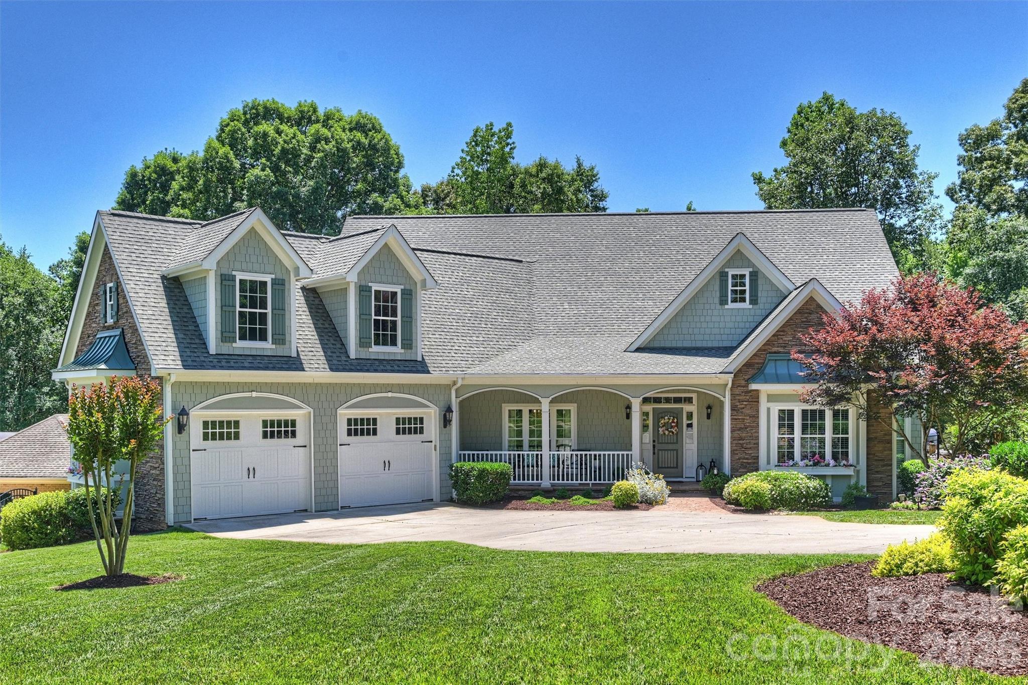 Welcome Home to this Charming Southern Beauty.  This Custom Built , Original Owner and Meticulously cared for , 4 Bedroom 4.5 Bath Home sits on a .46 acre lot backing to trees and the 18th hole of Springfield Golf Course.   Luxury Living in highly sought after Springfield Community of Fort Mill, SC.  
The Main Floor Features a Dining Room, Private Office, Primary Bedroom & Bathroom, Large Family Room that leads into the Gorgeous Open Kitchen, Breakfast Area and Sunroom.  Upstairs offers 3 Additional Bedrooms with their own Full Bathroom and 682 Sq Feet of Unfinished Bonus Space that can be easily finished for your needs.
The Backyard Features a Gorgeous Screened in Back Porch Overlooking a Stunning Manicured Yard and views of the Springfield Golf Course.  As well as your very own Conditioned Walk In Workshop/Storage Room to use for yard tools, crafts, or holiday items... the options are endless in this custom beauty.  
Springfield Community offers Outdoor Pool, Clubhouse, Walking Trails, Tennis Courts, Pickle ball Courts, Playgrounds and Recreational Areas.