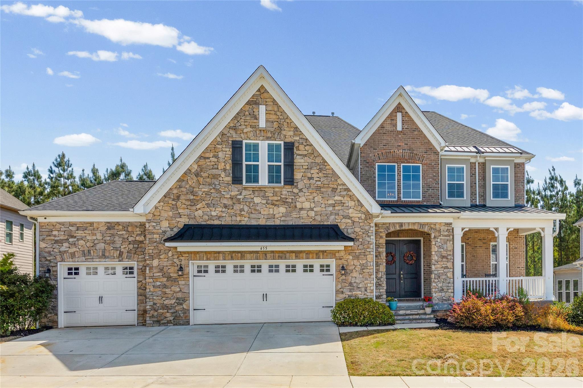 The sellers are offering a $10,000 incentive, which may be applied toward the buyer’s closing costs or taken as a cash credit. This offering enhances an already exceptional opportunity to secure this distinguished residence with added financial flexibility. A rare luxury offering at an affordable price in the highly sought-after Waterside at the Catawba community in the Fort Mill school district. This Taylor Morrison Rochester E model is thoughtfully designed for today’s lifestyle, with exceptional space for multi-generational living and working from home. Featuring 6 bedrooms, 5.5 baths, and a 3-car garage, the home offers luxury vinyl plank and prefinished hardwood flooring throughout. The main level welcomes you with an elegant foyer and a formal dining room with built-ins, wainscoting, and tray ceilings. The spacious great room with gas fireplace and custom built-ins flows seamlessly into the chef’s kitchen, complete with quartz countertops, a large island with seating for eight, gas cooktop, wall oven, microwave, and an adjacent dining area. A standout feature is the private main-level guest suite with its own living room, bedroom, and full bath, ideal for extended family, guests, or long-term stays. A built-in desk/workspace in the drop zone provides a convenient option for remote work, along with a powder room nearby. The screened porch with LVP flooring and a stone fireplace creates an inviting space to relax or entertain. Upstairs offers even more flexibility with a large bonus room and loft, perfect for additional work-from-home areas, study spaces, or media rooms. The split-bedroom layout includes an oversized primary suite with a large shower, water closet, and two walk-in closets. Three additional bedrooms are supported by a Jack-and-Jill bath, an additional full bath, and a laundry room with utility sink. The fully finished walkout basement is ideal for multi-generational living or private quarters, featuring a large family room, recreation area, bedroom, full bath, and a full kitchen and bar with café-style appliances, including refrigerator, stove, dishwasher, and sink. Two storage areas add even more functionality. For buyers with a vision for outdoor entertaining, this home is already positioned to take it to the next level. A second full electrical panel has been professionally installed specifically to support the future addition of a pool, spa, and expanded outdoor living space — a significant investment and a rare convenience that eliminates one of the most common hurdles buyers face when planning their dream backyard. Pool Drawing photos have been uploaded for reference. Additional features include a tankless water heater and a fully fenced yard backing to a wooded view. Residents of Waterside at the Catawba enjoy resort-style amenities including pools, clubhouse, fitness center, tennis courts, playgrounds, and walking trails with access to the Catawba River. This home offers a rare combination of luxury, flexibility, and space to live, work, and accommodate a variety of lifestyle needs. Property is currently zoned for the listed schools in the Fort Mill School District; however, it is the buyer’s responsibility to confirm at the time of contract that no changes have been made.
