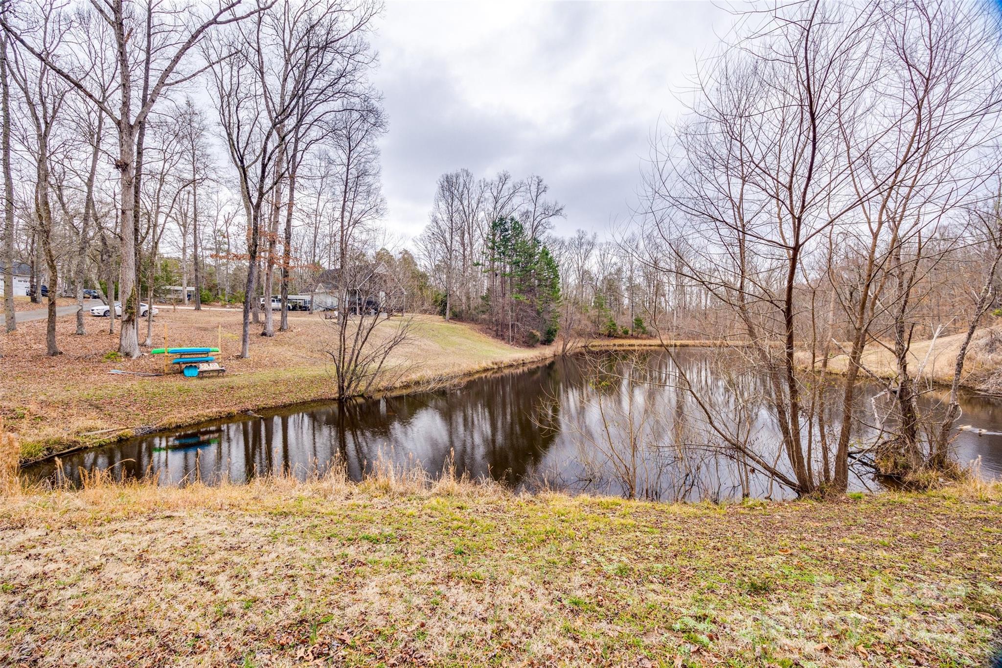 This 1 bedroom 1 bath Gem is a rare find! An apt with a Waterview and access to a fishing pond! This unit has a large private covered deck facing the pond and is perfect for relaxing after a hard day or simply enjoying nature. It is located on the second level of this property with an exterior entrance and 2 units below. Access stairs are on the left side. The spacious bedroom has a vaulted ceiling and a large closet. The kitchen features SS appliances, granite counters, and a tiled backsplash. The living, dining, and kitchen areas are one large room with a vaulted ceiling and connect to the large deck with sliders that offer lots of natural light. A full bath with a shower/tub combo in the hall and a washer/dryer combo in the closet. Parking is the carport to the left of the stairs. Pets conditional. Brand new HVAC. Electric, water, and sewer $100 a month paid to the owner.