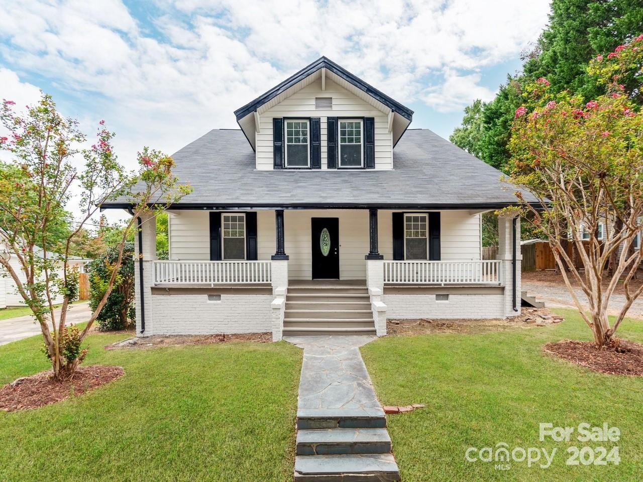 Introducing this delightful 6-bedroom, 2-bath residence in the heart of Albemarle, NC, ideally positioned on a generous 0.33-acre lot just a short stroll from local shopping and dining. Recently refreshed with a new coat of paint inside and out, this charming home welcomes you with a cozy rocking chair front porch and a gravel driveway. Upon entering, you'll be greeted by a bright and airy interior, featuring newly installed flooring throughout. The spacious kitchen showcases modern, all-new appliances that are included with the property. The expansive, fully fenced backyard offers ample space for outdoor activities, complete with a convenient storage building ideal for extra storage or hobbies. This home effortlessly combines comfort and convenience, offering a perfect setting to create lasting memories.