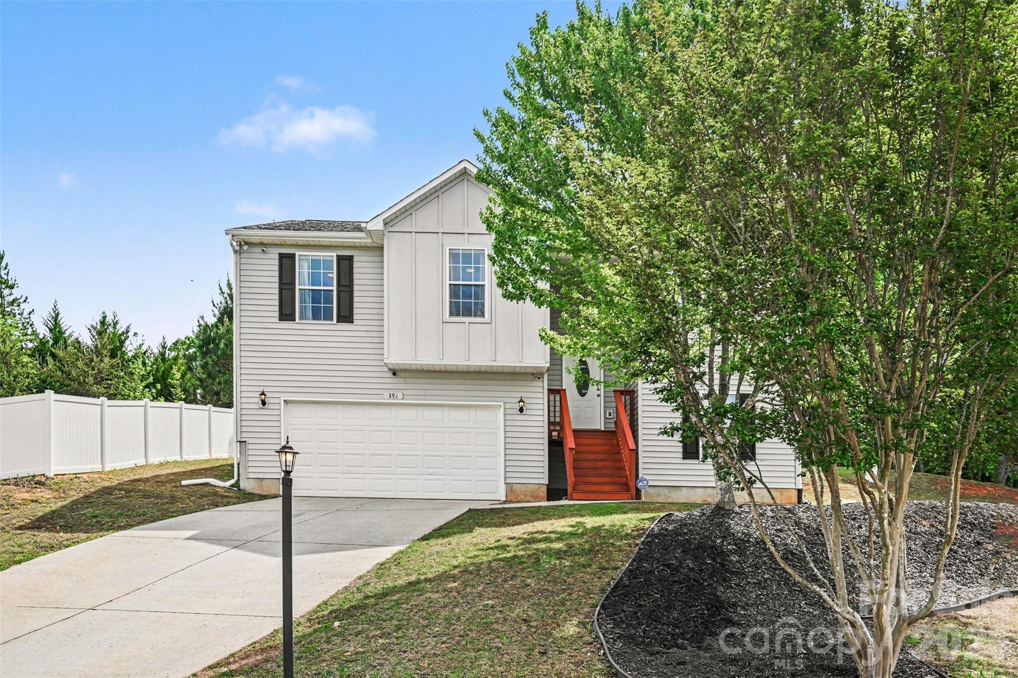 This move-in-ready home combines comfort, functionality, and flexible living areas designed for modern lifestyles.

Inside, the home features a bright open floor plan with multiple living areas, including a living room, family room, and bonus room that can be used for a home office, recreation area, or additional flex space. The kitchen is designed for everyday convenience and entertaining, offering granite countertops, upgraded cabinetry, and stainless steel appliances, with plenty of counter space and storage.

The layout provides four generously sized bedrooms and three full bathrooms, creating a comfortable and versatile floor plan. A gas fireplace adds warmth and character to the main living area, while durable flooring throughout the home supports both style and easy maintenance.

Step outside to enjoy the expansive backyard and outdoor living spaces, ideal for relaxing or entertaining. The property includes a deck offering a great setting for gatherings. The nearly half-acre lot provides additional room for outdoor activities, gardening, or future enhancements, while the home’s position in a cul-de-sac adds a sense of privacy and limited through traffic.

Additional features include an attached two-car garage and wooded views behind the home, contributing to a peaceful outdoor environment. With its combination of spacious interiors, flexible living areas, and attractive outdoor amenities, this Clover property presents a strong opportunity for buyers seeking a well-maintained home with room to grow.  Home warranty included for additional peace of mind.