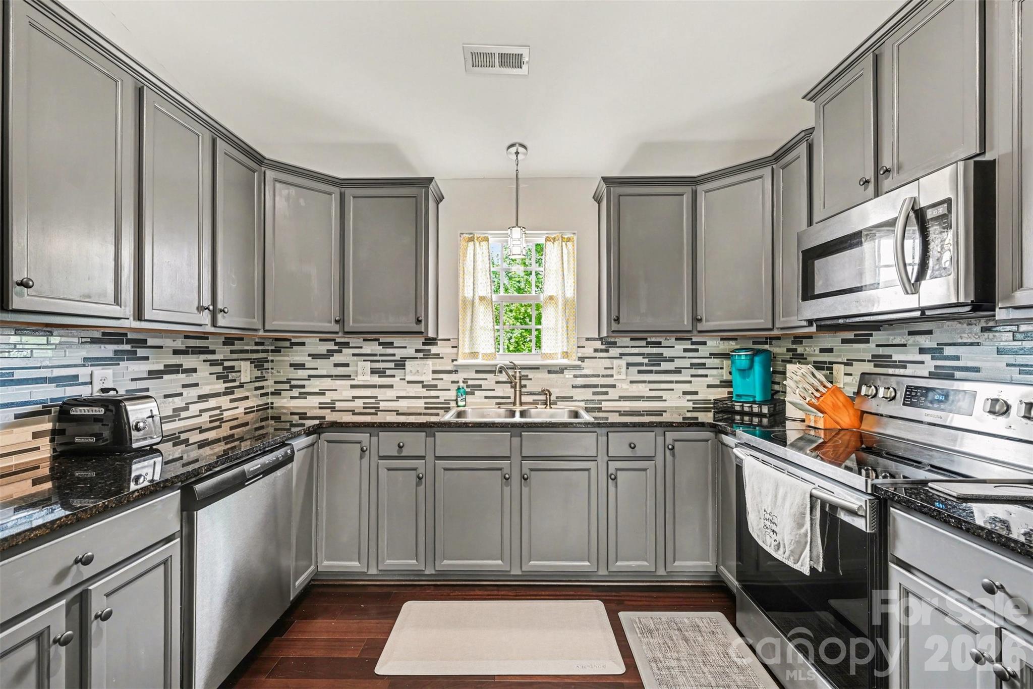 *USDA ELIGIBLE* Imagine starting your mornings with coffee on the deck as you overlook the peaceful, tree-lined backyard and ending the day gathered around the fireplace. Tucked away on a quiet cul-de-sac in desirable Clover, this beautifully maintained, move-in ready home offers the perfect balance of comfort, space, and everyday convenience.

With over 2,400 square feet, 4 bedrooms, and 3 full bathrooms, the thoughtfully designed floor plan adapts to the way you live. Multiple living areas provide flexibility for entertaining, relaxing, or working from home, while the spacious bonus room is ideal as a home office, media room, fitness space, playroom, or guest retreat.

At the heart of the home, the open-concept kitchen is designed to bring everyone together. Featuring granite countertops, stainless steel appliances, abundant cabinetry, and generous prep space, it's equally suited for weeknight dinners, holiday gatherings, and everything in between. The adjoining family room with a cozy gas fireplace creates a warm, inviting atmosphere you'll love coming home to.

The spacious primary suite offers a peaceful escape, while the additional bedrooms and full bathrooms provide comfort and flexibility for a variety of living arrangements. Natural light, neutral finishes, and a functional layout make every room feel bright, welcoming, and ready for your personal touch.

Step outside to enjoy the large deck and private backyard surrounded by mature trees—a perfect setting for outdoor dining, weekend barbecues, gardening, or simply unwinding after a long day. The attached two-car garage provides plenty of room for vehicles, storage, and outdoor gear.

Conveniently located just minutes from shopping, dining, parks, recreation, and everyday amenities, this home offers the space you need, the features you want, and the lifestyle you've been searching for. If you've been looking for a home that feels welcoming from the moment you arrive, this is one you won't want to miss. Schedule your private tour today!  Home warranty included for additional peace of mind.