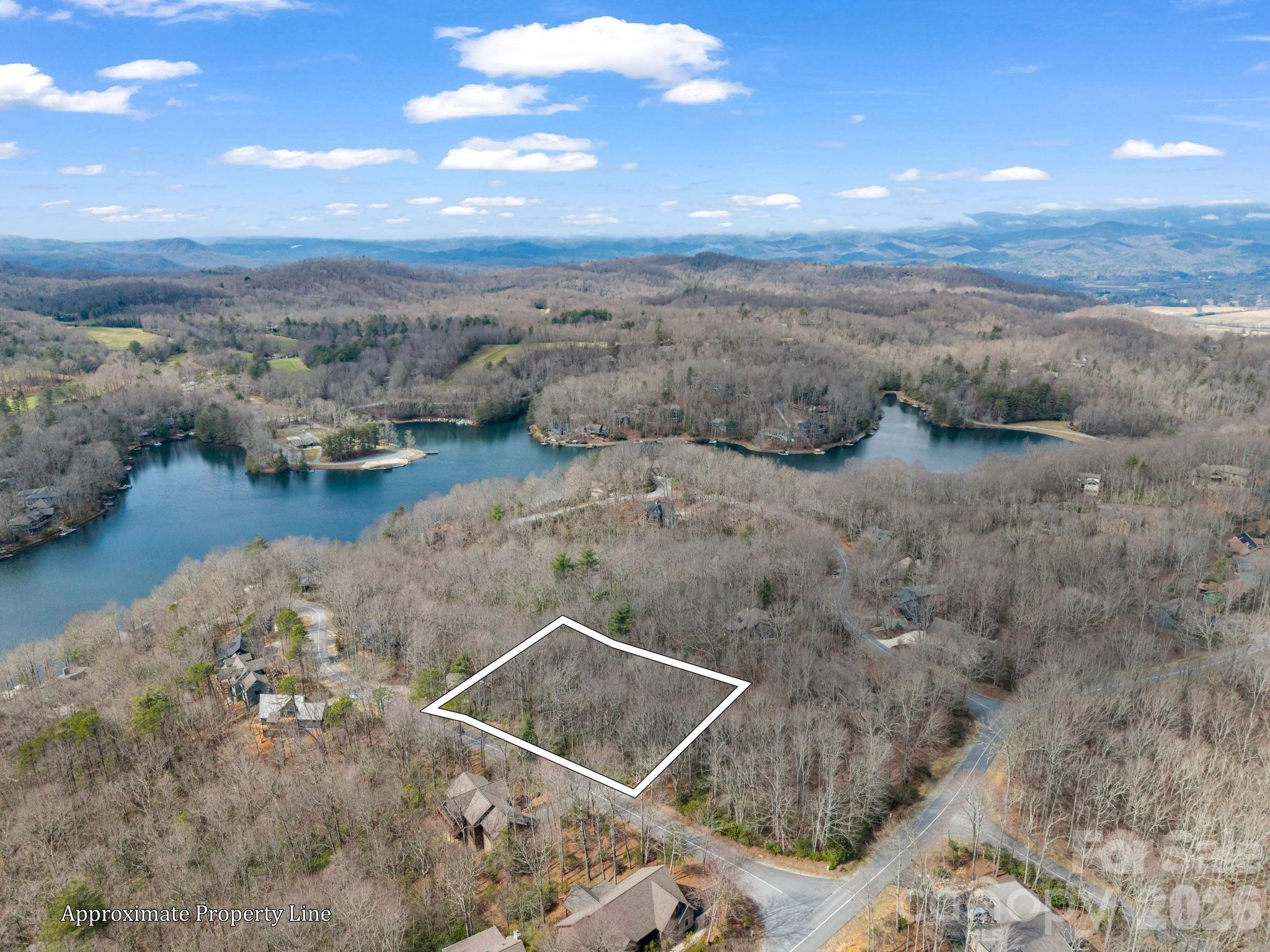 An exceptional opportunity to build your dream mountain retreat in the gated community of Connestee Falls. Located on quiet Gawanv Court near the East Gate, this rare 1.05-acre homesite was thoughtfully created by combining three separate lots into one expansive parcel - a significant investment that offers added privacy, flexibility, and buildability. A local builder has already walked the property and confirmed its strong building potential, giving buyers added confidence as they plan their future home. Even better, the lot connects easily to Connestee’s community water and sewer system - no well drilling or septic concerns to navigate. Positioned just minutes from the East Gate and close to the community’s premier amenities, you’ll enjoy convenient access to the clubhouse, designer golf course, lakes, tennis and pickleball courts, outdoor pool, fitness center, and miles of scenic hiking trails. Seasonal winter views add to the charm, with the opportunity to enhance views depending on your home design. Large, combined parcels like this are increasingly hard to find in Connestee Falls. Secure your piece of mountain living and start building the lifestyle you’ve been dreaming about.