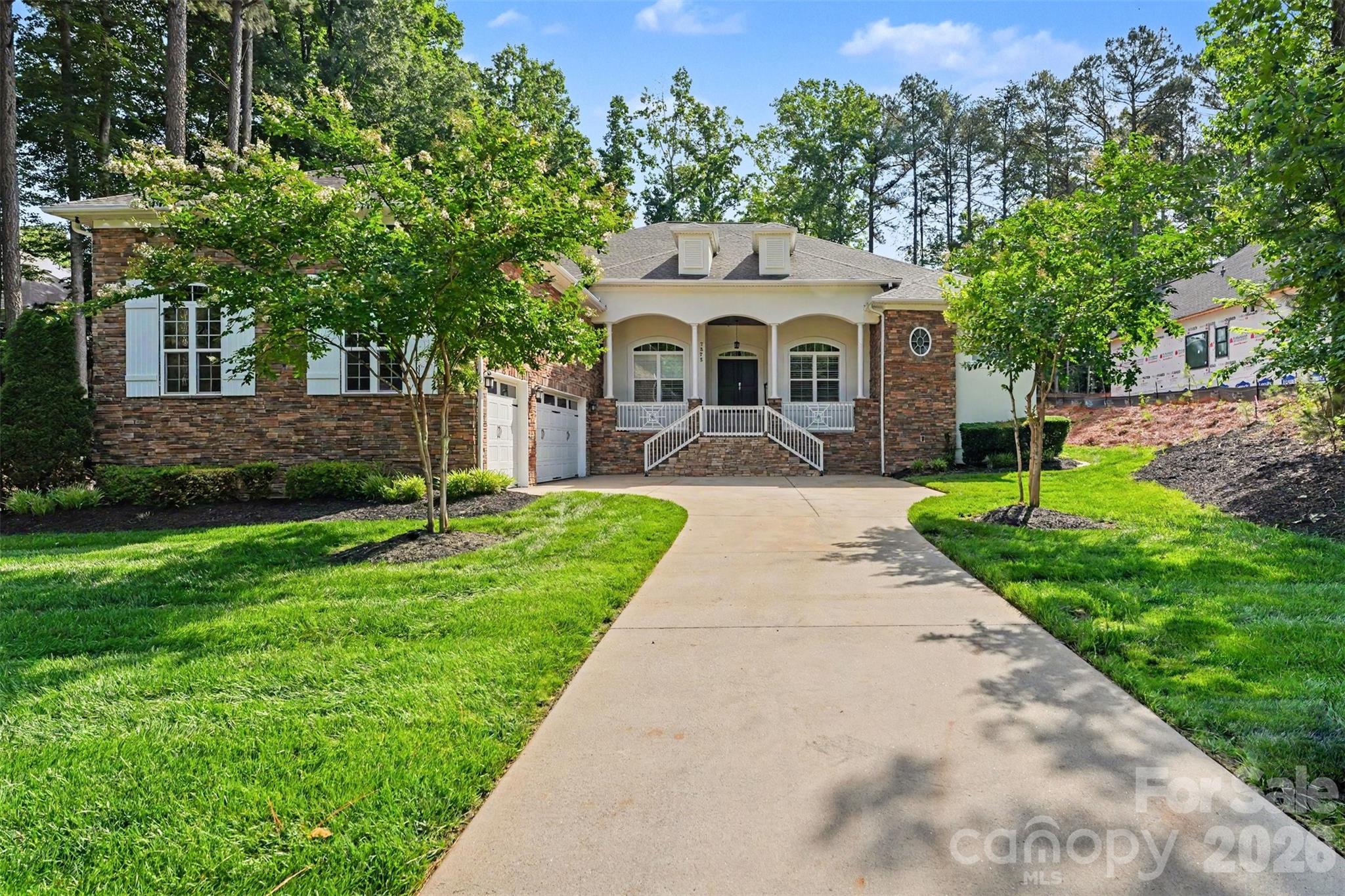 Exceptional custom-built one-story home blending luxury, comfort, and cutting-edge technology. Open floor plan showcases rich hardwood flooring, custom archways, and tray ceilings throughout main living areas. Formal living room features a stacked stone gas log fireplace, built-ins, and a striking 500-gallon mixed reef aquarium. Elegant dining room with picture frame molding is ideal for entertaining.
Gourmet kitchen designed for the discerning chef with double ovens, gas range, granite countertops, tile backsplash, stainless appliances, and a large center island with prep sink—all open to the great room. Private primary suite offers a spa-like bath with dual vanities, makeup area, garden tub, and tiled shower. Split-bedroom layout includes three additional bedrooms, one with ensuite bath perfect for guests or multi-generational living.
Outdoor living shines with an expansive deck, outdoor kitchen, and gas fire pit—perfect for relaxing or entertaining. Oversized 3-car garage with 20-ft ceilings, a 50 amp EV charger and a 10K lb lift  ideal for car enthusiasts. Smart home system and whole-home automatic generator provide modern convenience and peace of mind. Located in a desirable community with gated boat storage and easy access to a public boat launch at Little Creek .2 miles away.
