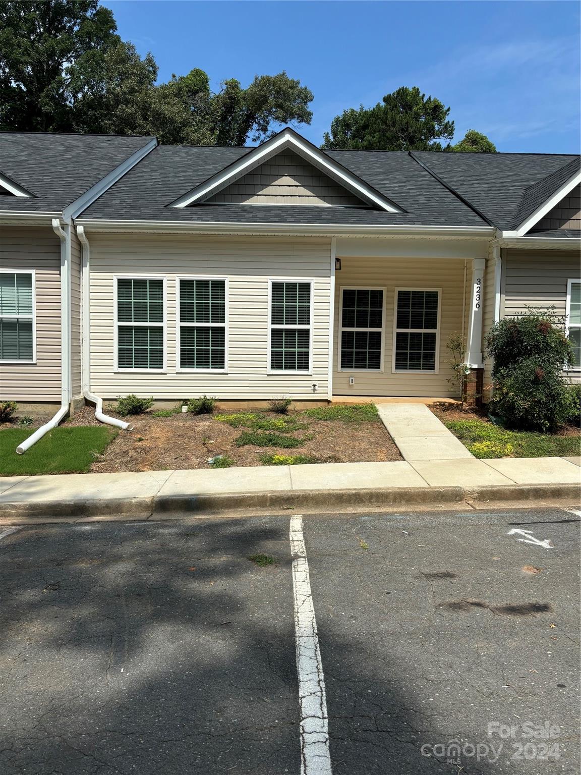 New townhome with 9 ft ceilings, quartz countertops, LVP flooring, custom cabinets, tile showers, large back patio.