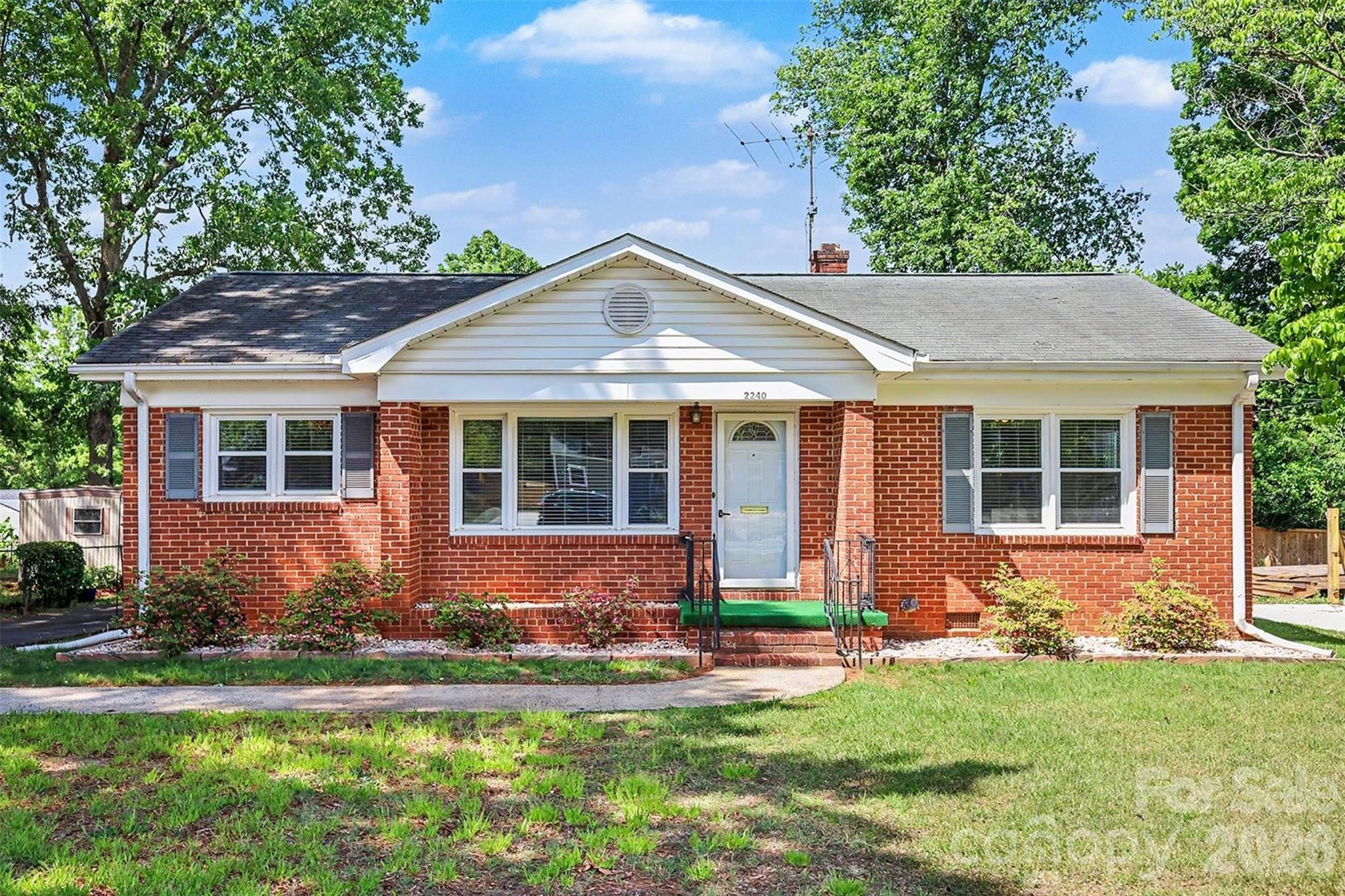 Opportunity meets location at 2240 Ashley Road — a classic brick ranch just minutes from Uptown Charlotte. This charming 3-bedroom, 1-bath home offers approximately 1,100 square feet of functional living space and sits on a generous lot with multiple carports and storage shed. The property provides flexibility for homeowners or investors seeking simple, convenient living close to the city’s core. Built in 1956, the home combines charm with a well maintained and simple floor plan, including improvements to HVAC system (2024) and other home systems adding efficiency and peace of mind.
Positioned in one of West Charlotte’s rapidly evolving areas, this location places you within minutes of Uptown employment centers, dining, entertainment, and major commuter routes. Ongoing redevelopment, new construction, and continued investment throughout the corridor are driving increased demand and long-term growth potential, making this an attractive option for both owner-occupants and investors.
Whether you're looking for a primary residence near the city, a rental property, or a value-add opportunity in a growing area, this home delivers. With key system updates, a functional layout, and proximity to Uptown Charlotte, 2240 Ashley Road offers accessibility today with strong upside for the future.

***Offering a one (1) year home warranty through America's Preferred Home Warranty***

Disclosure: 
1.) Underground Storage unit on property - no longer in use. Previously used for heating oil, tanks are empty.