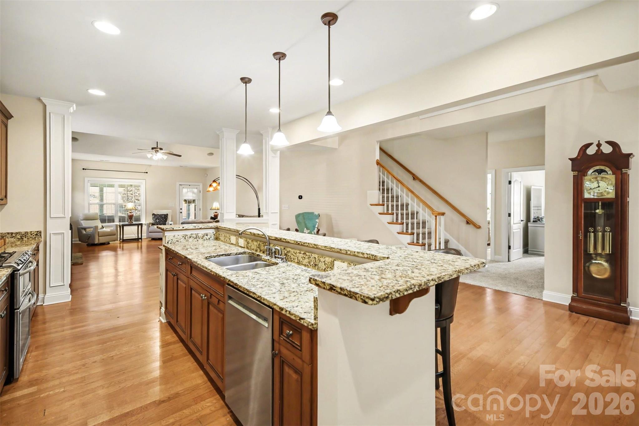 Welcome to 7999 Worth Way, a beautifully maintained 5-bedroom, 3-bath home in the highly desirable Denver, NC area, just minutes from Lake Norman. This spacious 1.5-story home offers the perfect combination of modern comfort, flexible living space, and an exceptional location.

The open-concept floor plan is designed for both everyday living and entertaining, featuring a seamless flow between the kitchen, dining area, and family room. The impressive living room showcases a floor-to-ceiling stone fireplace with custom built-in cabinetry, creating a warm and inviting gathering space.

The main-level primary suite offers a private retreat with a spacious bedroom, spa-inspired bath, walk-in shower, relaxing garden tub, and oversized walk-in closet. With five bedrooms and multiple living areas, this home easily accommodates guests, multigenerational living, remote work, or growing households.

Upstairs, a versatile loft overlooks the main living area and provides the perfect space for a home office, media room, playroom, or second living area. Enjoy year-round relaxation in the bright sunroom overlooking the backyard or spend quiet mornings on the welcoming covered front porch.

Located near Lake Norman, this home offers convenient access to boating, fishing, waterfront dining, parks, and outdoor recreation. Golf enthusiasts will appreciate being just minutes from Cowans Ford Golf Club, while shopping, restaurants, healthcare, and major commuting routes are all nearby.

If you're searching for a move-in ready home with an open floor plan, spacious primary suite, flexible living spaces, and a prime Denver, NC location near Lake Norman, 7999 Worth Way is a must-see.