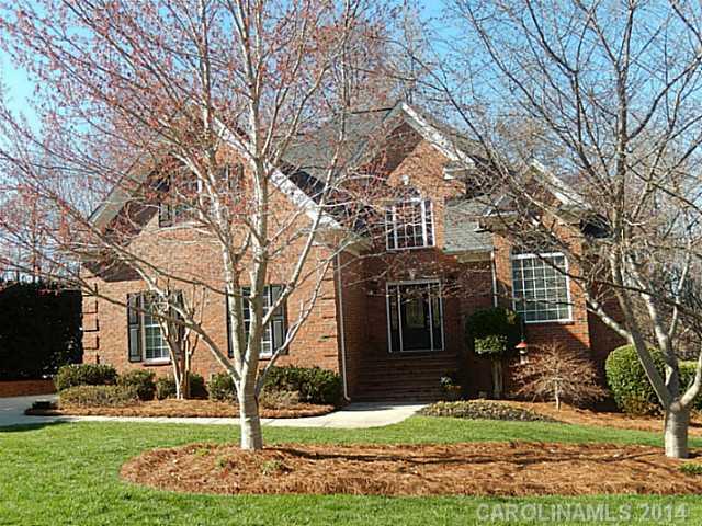 Custom built with superior quality & attention to detail.  Quiet community of 17 all brick homes, tucked away, but close to shopping & restaurants in Wesley Chapel.  This home has three bedrooms up, master on the main, one bedroom on the basement level.  Hardwoods on most of main level, granite counters and stainless appliances.  Deck, Covered porch, covered patio & wooded backyard!  Home Warranty
