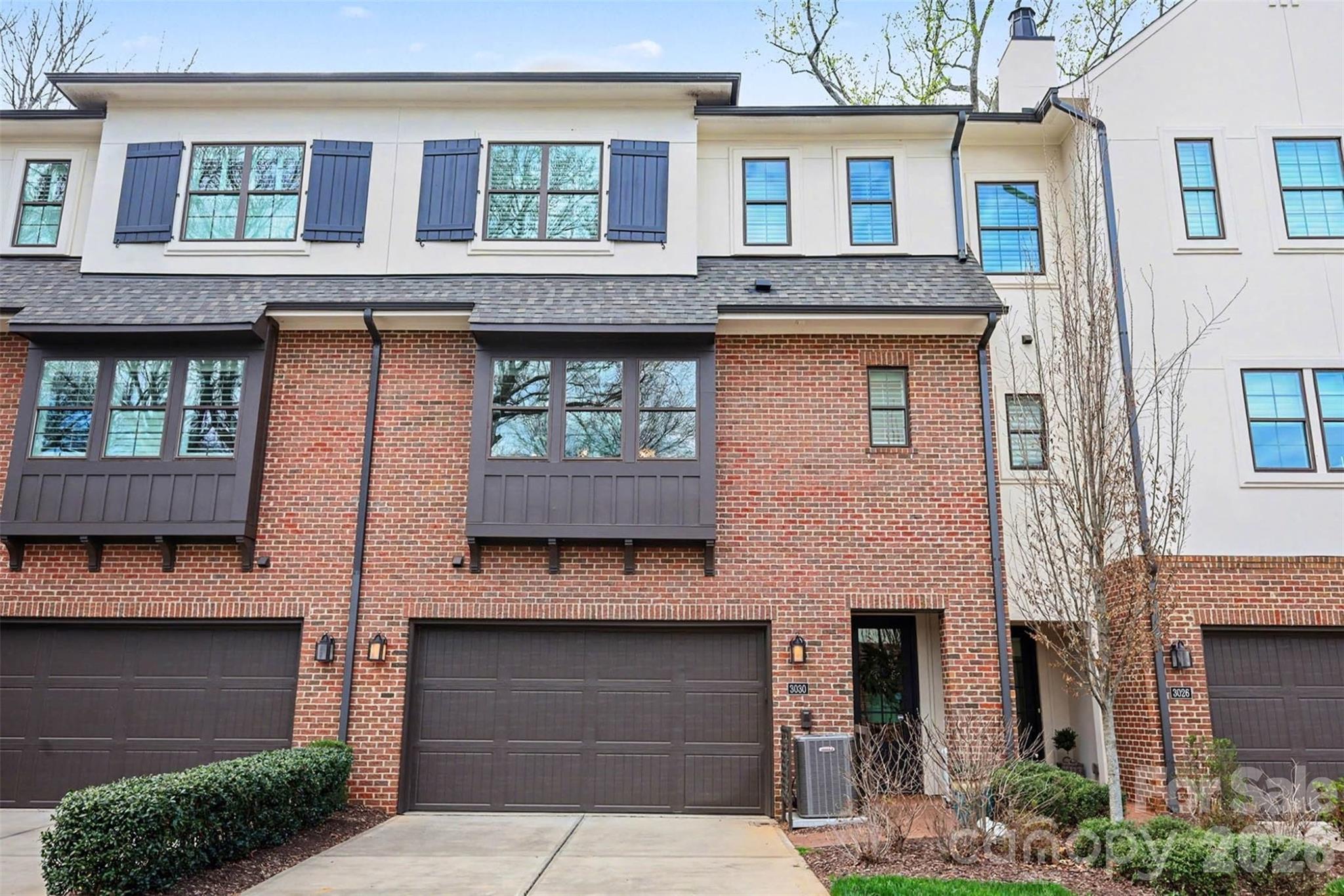 Located in the heart of SouthPark, this luxury three-story townhome by highly regarded Charlotte builder Simonini offers over 3,100 square feet of thoughtfully designed living space — with one of the most sought-after features in the community: a private in-home elevator serving all three levels.
Unlike the majority of townhomes in this neighborhood, this home eliminates the one hesitation most buyers have about multi-story living. The elevator accommodates up to 950 pounds, making it practical for everyday use — groceries, luggage, furniture, and mobility needs alike. Whether you're buying for now or planning ahead, this is a feature that truly sets this home apart.
Built in 2018, the home features four bedrooms, three full baths, and one half bath, along with a two-car garage. The second floor serves as the main living area, featuring high ceilings and a well-appointed kitchen with an oversized marble island, 42-inch cabinetry, under-cabinet lighting, designer range with hood, and built-in microwave. The kitchen opens to the living room with a gas fireplace and access to a covered balcony overlooking wooded privacy behind the home. Wood and tile flooring run throughout the residence.
The third floor includes the primary suite with a walk-in closet, along with two additional bedrooms and bathrooms. The entry level provides a flexible recreation room or fourth bedroom, ideal for guests, office space, or additional living. Positioned toward the rear of the community, this home enjoys a more private setting within the neighborhood.
Enjoy being just minutes from SouthPark Mall, Phillips Place, and some of Charlotte's premier shopping and dining destinations.