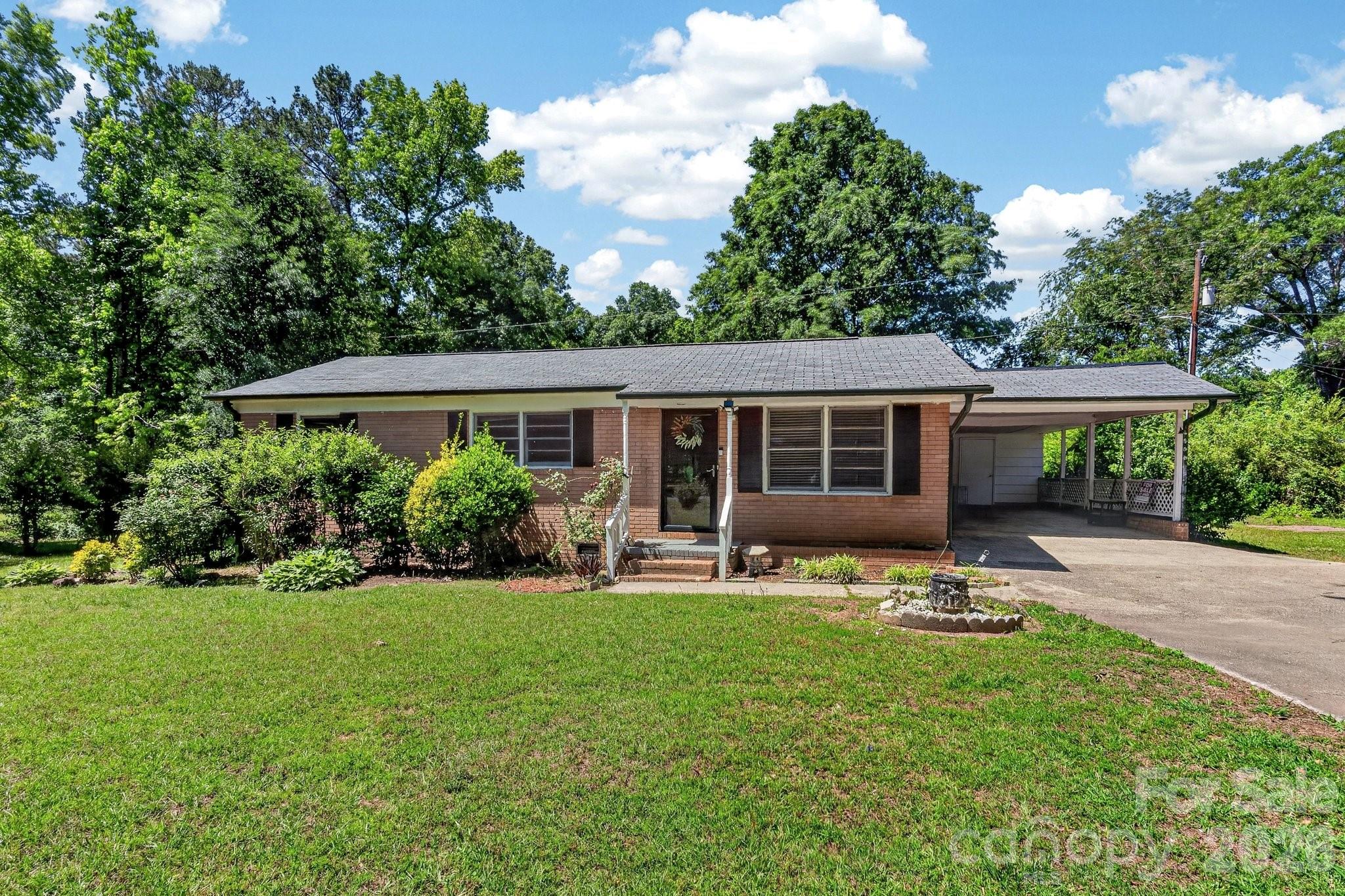 Searching for space and privacy in the sought-after Buford school area—all without the restrictions of an HOA? This one checks the boxes. Set on nearly an acre, this 3-bedroom, 1.5-bath home offers close to 1,600 square feet of comfortable living space and endless potential. Inside, you’ll find a functional layout ready for your personal updates and style—an ideal opportunity to create a home that truly reflects you. Step outside to a spacious deck with a patio set, perfect for relaxing or entertaining while overlooking your private backyard retreat. There’s plenty of room for outdoor activities, gardening, or simply enjoying the peace and quiet. Don’t miss your chance to own a property with space, flexibility, and a prime location!
