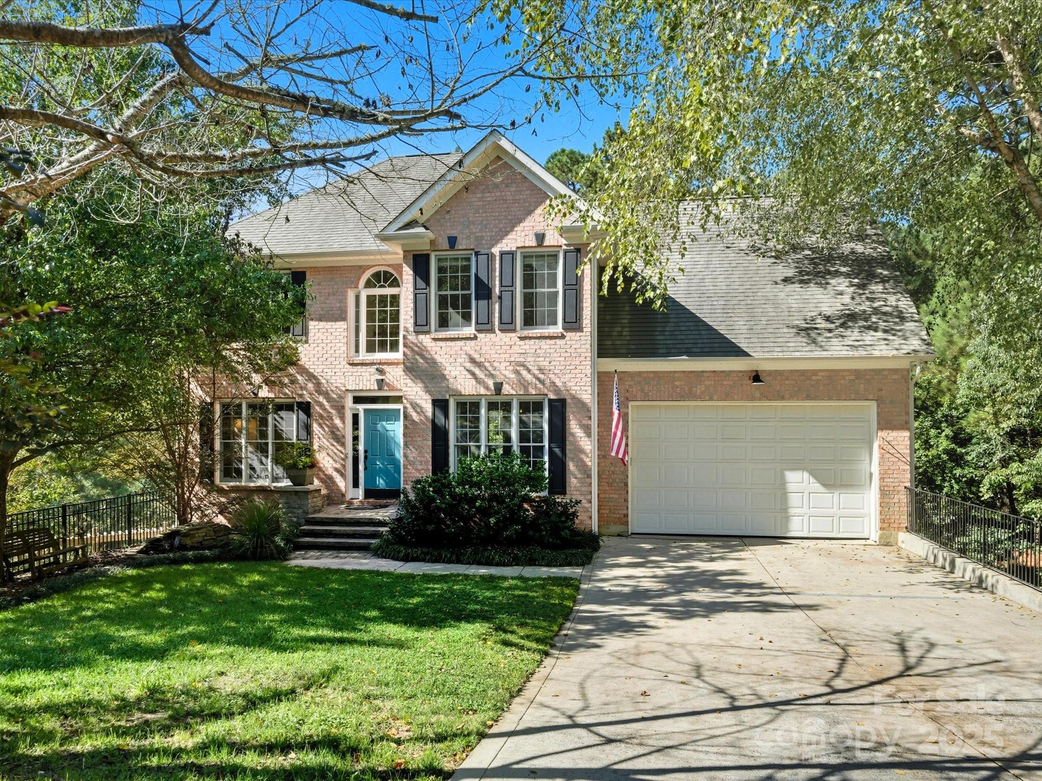 Welcome Home to this beautifully updated 5-bedroom home on a private 0.6-acre cul-de-sac lot in desirable Tega Cay. This well-maintained home with a full walk out basement, offers everything with NO HOA restrictions and award-winning Fort Mill Schools.  The heart of this home has incredible custom built-ins, including a sophisticated dining room library wall, a bright office with integrated workspace, and mudroom storage solutions.  The main level flows seamlessly with beautiful hardwood floors and open-concept living.  The second floor provides four bedrooms including a luxurious primary suite with updated spa-like bathroom featuring dual vanities and glass shower and a large laundry room.  The walkout finished basement features a kitchenette, bedroom, full bathroom, recreation room, and office space. Multiple rear porches overlook the private wooded lot, creating perfect spaces for morning coffee, gatherings, or quiet evening retreats. Custom built-ins throughout, ample storage, updated primary bathroom, beautiful hardwood floors, and thoughtful design details make this house truly move-in ready.  Washer, Dryer and both refrigerators convey! Tega Cay offers endless recreational amenities including golf, tennis, swim and lake access.  This home is just a short commute to Charlotte, Rock Hill, Ballantyne & more! Don't miss your chance to own this home!