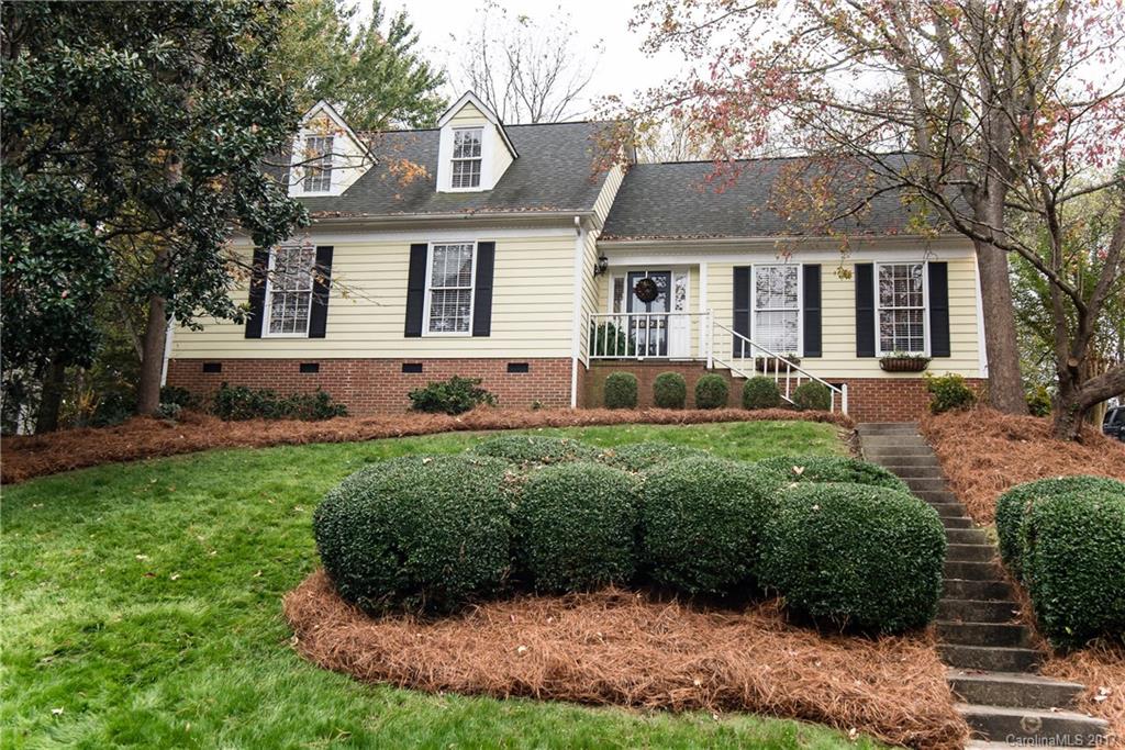 SO charming!! This home has hardwoods on main, custom light fixtures, remodeled kitchen with farmhouse sink/granite counters/custom backsplash, vaulted ceiling with wood beams, gas log fireplace,  spacious bedrooms, privacy fence, two storage sheds and a playhouse convey. Wrought iron gates open to parking pad in rear. Expansive backyard. HUGE walk-in attic storage! This home is tucked away in the neighborhood and does not back up to Carmel Road.