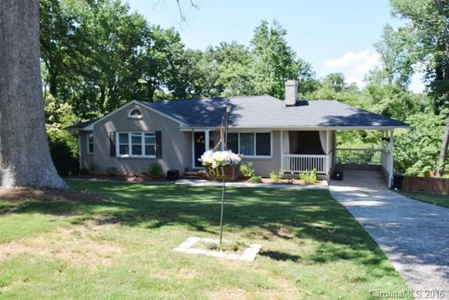 Gorgeous ranch home completely remodeled with fully finished walkout basement! Three bedrooms, three full baths on the main level and two additional bedrooms with full bath downstairs for a total of 5BR/3Ba!  Large great room with gas log fireplace, beautiful granite kitchen has work island and breakfast area! Hardwood and tile flooring throughout.  Sandpaver patio area, storage shed, and attached carport. Must see!