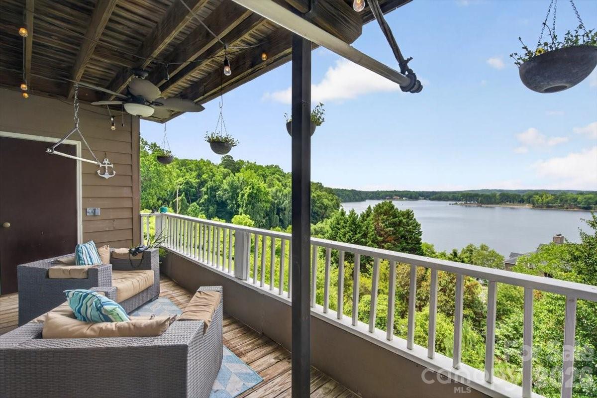 Enjoy breathtaking views of Lake Wylie from this beautifully maintained waterfront condo in the sought-after Emerald Point community. The open, light-filled floor plan showcases stunning lake views from the main living areas and the spacious primary suite. The inviting great room is highlighted by a stacked stone fireplace and opens to the private covered balcony—the perfect place to relax while taking in spectacular sunsets over the water. The spacious primary suite also offers direct balcony access and features an ensuite bath with dual vanities, a walk-in shower, separate garden tub, and a large walk-in closet. A generously sized secondary bedroom, full guest bath, and dedicated laundry area complete the home.

Emerald Point offers resort-style amenities including a waterfront pool, sidewalks, and beautifully maintained grounds. HOA dues include water and a termite bond. Conveniently located near Charlotte Douglas International Airport, I-485, I-77, Charlotte Premium Outlets, shopping, dining, and more, this home offers the perfect blend of peaceful lakefront living and everyday convenience.