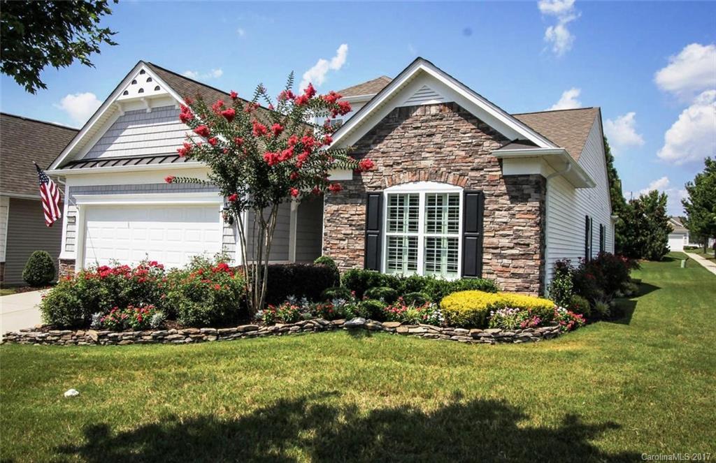 Elegant & beautifully upgraded Vernon Hill w/Sunroom! Details Galore--hardwood floors everywhere, plantation shutters-all windows, stunning built-ins w/accent lighting & speaker, solotube & recessed lighting, custom closet built-ins, well appointed kitchen w/pullouts in cabinets, granite, ss appliances, built-ins in laundry room, 3rd BR set up as office w/built-in desk & cabinets, gas grill w/ cobblestone courtyard patio, fenced yard,beautiful landscaping! 55+ Resort Style Living!