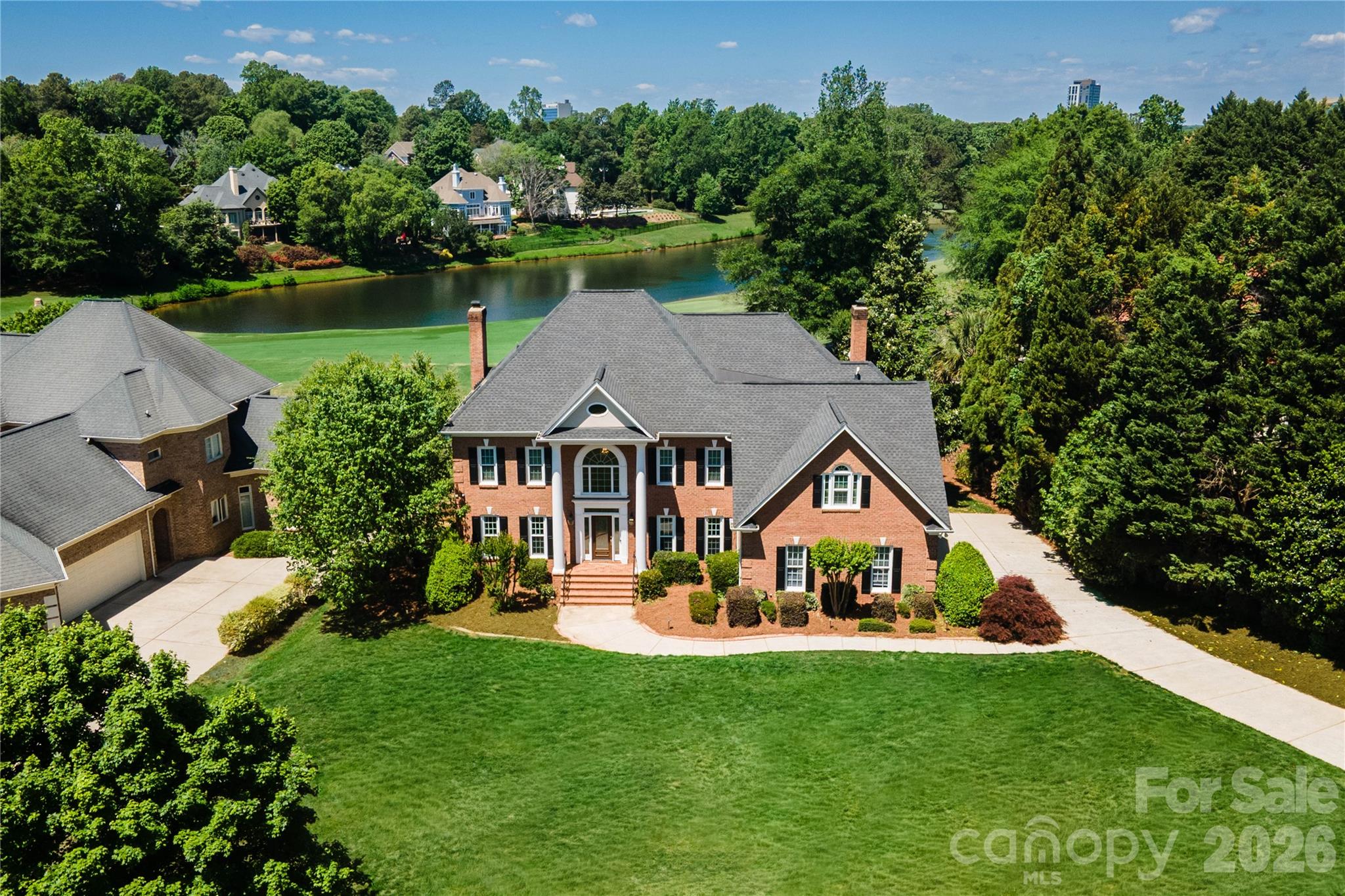 Situated on one of the largest and most desirable lots in Ballantyne Community, this exceptional property offers spectacular water and golf course views overlooking the 7th hole. The setting is truly unmatched, combining privacy, space, and breathtaking scenery.

Designed for both everyday living and entertaining, the home features an inviting, open floor plan filled with natural light and expansive windows that showcase the stunning surroundings. The spacious main living areas flow seamlessly, creating a warm yet elegant atmosphere.

A standout feature is the custom-built bar—perfect for hosting gatherings or enjoying a relaxed evening at home. The kitchen and adjoining living spaces are thoughtfully designed to bring people together while maximizing the incredible views.

The primary suite provides a peaceful retreat with generous space and a well-appointed bath, while additional living areas offer flexibility for entertaining, work, or relaxation.

This is a rare opportunity to own a premier homesite with sweeping water and golf course vistas in one of Charlotte’s most sought-after communities.