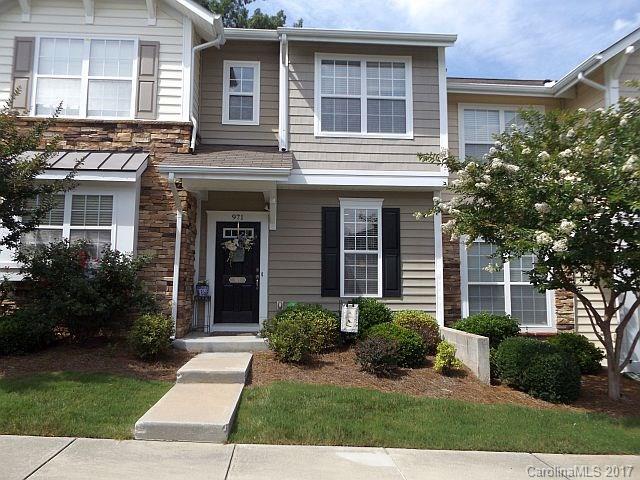 Cozy 2/1.5 townhome w/fenced private patio that backs up to tree line. Cherry cabinets in kitchen & black Maytag appliances, great room w/gas log fireplace & dining area combined. Master w/vaulted ceiling too! Close to everything, community pool & Fort Mill schools!