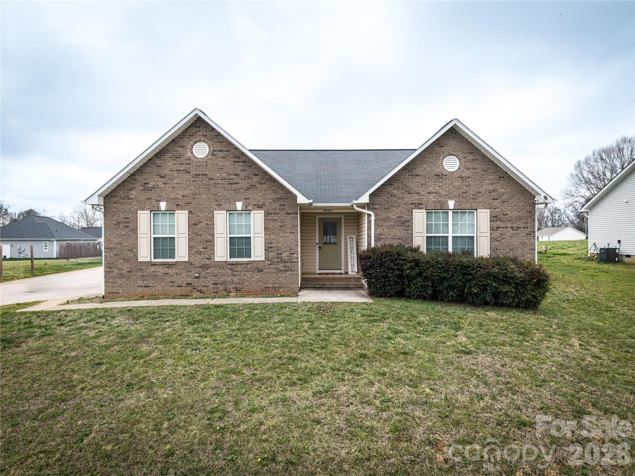 Welcome home! This charming ranch-style home features attractive brick and vinyl siding and offers convenient one-level living with an open-concept layout perfect for entertaining.

As you enter, you are welcomed into the family room which includes a cozy gas-log fireplace, creating the perfect space for relaxing or gathering with guests. A door from the family room leads to the back porch, overlooking the fenced backyard that also provides a storage shed (that will also stay with the home). From the family room comes the dining area that flows seamlessly into the spacious kitchen, complete with ample cabinet and counter space and all appliances included. Just off the kitchen is a laundry room with an additional pantry area that provides extra storage and leads directly into the attached two-car garage.

The home offers three comfortable, carpeted bedrooms. The primary bedroom features a private en-suite bathroom with a jetted tub, separate shower, and a walk-in closet. The two additional bedrooms share a hallway that leads to the first full bathroom.

Situated on approximately 0.36 acres, the property offers a spacious, private backyard—ideal for outdoor enjoyment, entertaining, or simply relaxing in your own peaceful space.