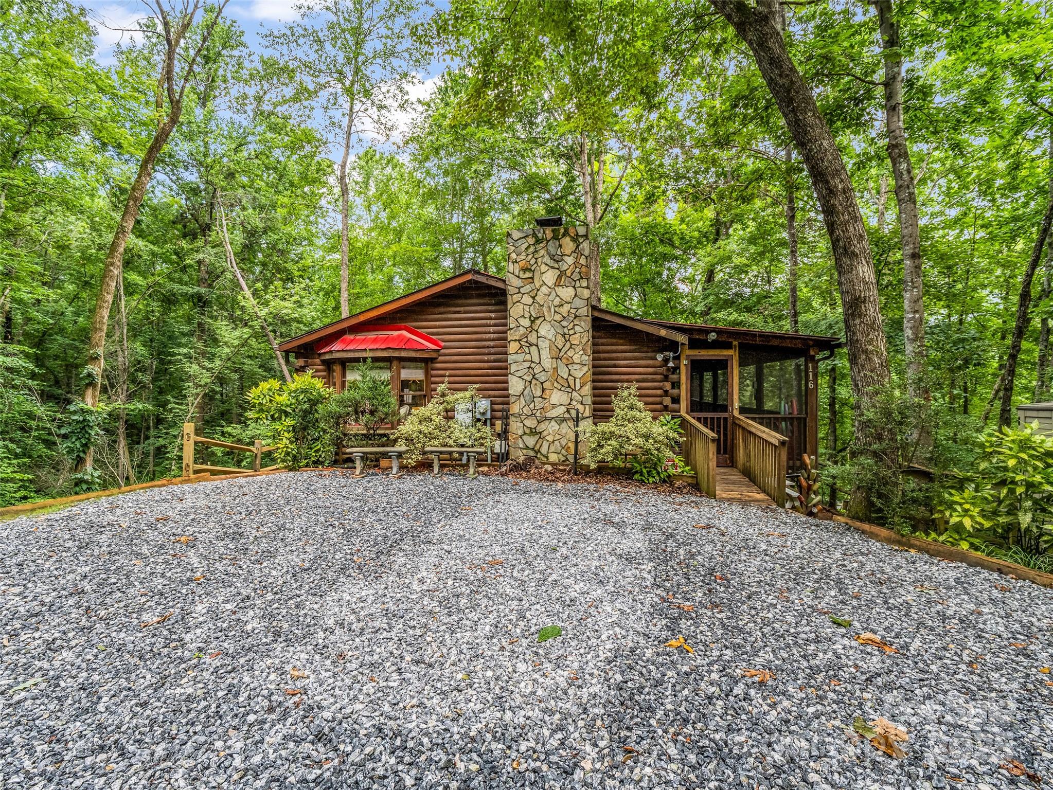 Tucked within the peaceful beauty of Rumbling Bald, this inviting 2BR/2BA log cabin seamlessly blends rustic charm with modern comfort. A welcoming wraparound covered deck, featuring private access to the primary suite, sets the tone for relaxed mountain living from the moment you arrive. Enjoy quiet mornings and cozy evenings on the screened front porch or gather by the wood-burning fireplace in the open-concept living area, highlighted by warm hardwood floors throughout.

The thoughtfully designed kitchen offers both charm and functionality, with conveniently tucked-away laundry. Outdoors, you’ll find level parking, a seasonal creek and waterfall, and winter views of Rumbling Bald Mountain and Bald Mountain Lake, creating a truly serene setting.

Enjoy true peace of mind with recent upgrades including a new deck, new fencing, a newly constructed retaining wall, and a crawl space enhanced with a freshly installed vapor barrier and insulation. 

Offered fully furnished and turn-key, this property also boasts a proven short-term rental history, making it an excellent opportunity for immediate income. Whether you’re seeking a weekend retreat, full-time residence, or investment property, this mountain escape is ready to deliver.