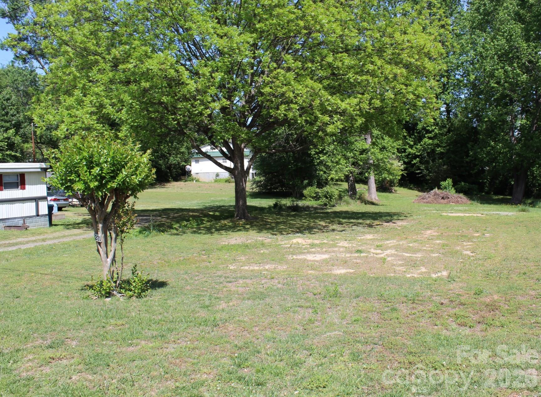 This 0.29 acre homesite at 221 37th Street SW in Hickory offers a versatile canvas for your next build, with a convenient location that balances everyday access and outdoor recreation. The property sits along a street with a mix of site built and manufactured housing in the broader area, but buyers should be aware that the City of Long View no longer permits new mobile homes and this parcel is classified as a nonconforming lot under current standards. Because of the lot’s width, any future construction is expected to require a variance from the City of Long View, and the seller is currently awaiting confirmation from the city regarding the feasibility of a variance. From this southwest Hickory and Burke County location, you are a short drive from city parks and greenway connections within the larger Hickory parks and recreation system, including options for biking, walking, and outdoor enjoyment, as well as convenient access to shopping, dining, and major road connections. Site and utility conditions, together with any building restrictions or required approvals, should be confirmed by the buyer with the appropriate city and county departments prior to construction.
