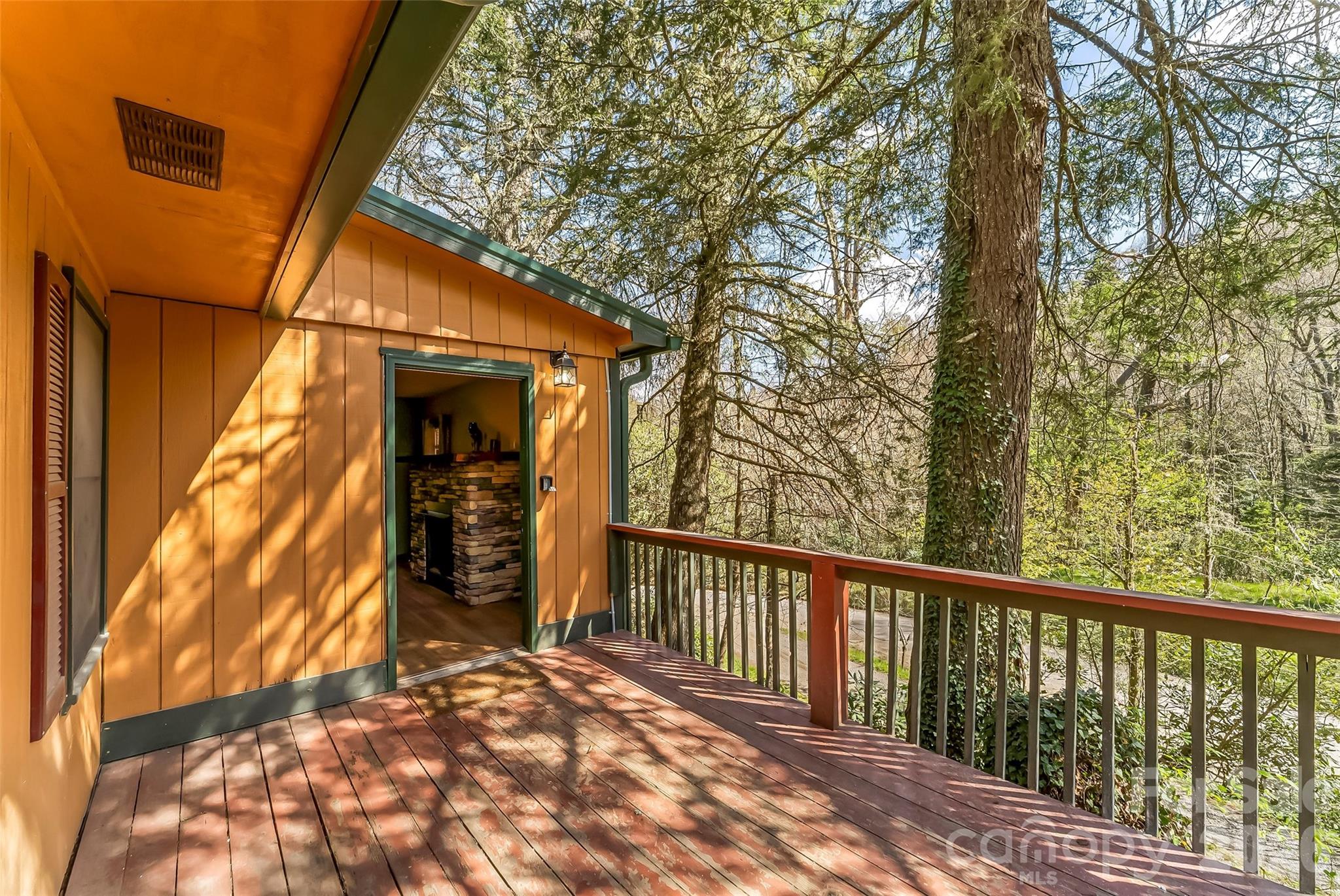 NEWLY UPDATED! Your mountain escape—and income opportunity—awaits in beautiful Maggie Valley. With a proven track record as both a short- and long-term rental, this charming retreat is equally suited for investment or your own private getaway.

Tucked away on over half an acre with fencing and a peaceful, woodsy backdrop, this home invites you to slow down and settle in. Inside, you’ll find 2 bedrooms plus a spacious bonus room, giving you plenty of flexibility for guests, work, or play. Vaulted ceilings elevate the kitchen, where stainless steel appliances and ample dining space make gathering easy. The open living area centers around a stunning stone gas-log fireplace, bringing cozy, lodge-style vibes year-round. Fresh luxury plank flooring flows throughout, adding a clean, updated feel.

Step outside and take it all in—whether you’re sipping coffee on the covered porch, unwinding on the deck, or soaking in the quiet mountain setting. A new well adds peace of mind, while the surrounding nature delivers that true “getaway” feeling.

And when adventure calls, you’re in the perfect spot—just minutes to skiing, hiking, the Blue Ridge Parkway, and all the fun of Maggie Valley. Whether you're looking to relax, explore, or earn, this one checks all the boxes.