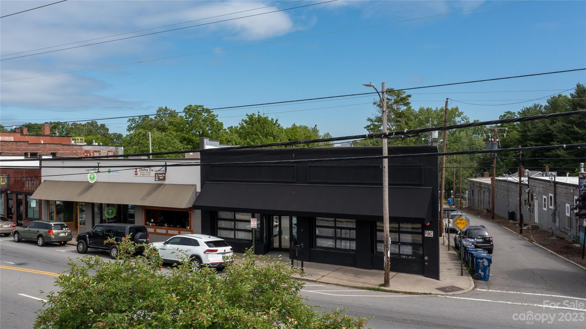 Rare opportunity to own a West Asheville landmark located on vibrant Haywood Road. Formerly The Mothlight music venue, 701 Haywood Road is now home to a thoughtfully curated blend of tenants including a special event venue and a nationally recognized restaurant. Built in 1924 and immaculately renovated in 2013 with new plumbing, new mechanical and electrical systems, a new roof, sprinklers and kitchen/bar infrastructure. It also maintains the historic integrity of the original building with refinished original hardwood floors, exposed beam ceilings and exposed brick walls. The lower level includes easily accessible storage and workshop space that could convert to additional rental income. Contact Listing Agent for showings. DO NOT DISTURB TENANTS.

Highlights
Fully Leased
Main Level: 3,810 SF
Lower Level: 3,495 SF
Some equipment included