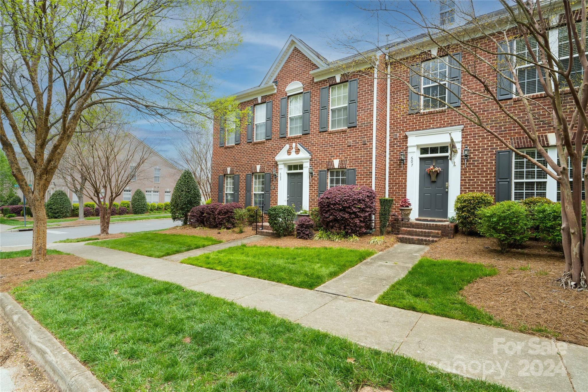 MOVE-IN READY spacious PRIMARY BEDROOM DOWN 2 story townhome in desirable city of Davidson!  Brand new plush carpet, freshly painted, almost new GE Stainless wall oven/microwave combo, Refrigerator and Washer(almost new) and Dryer convey!  Walk to downtown Davidson for dinner or morning coffee! First floor has large office with beautiful glass doors, Spacious kitchen with island and 42" cabinets, tile backsplash and tile floor, large 2 story great room with gas log fireplace and spacious primary bedroom with tray ceilings and luxury primary bathroom with large closet, first floor laundry room and over-sized powder room. Second floor features large loft area, full bath, and 2 generously sized bedrooms.  2 car detached garage and very cute and cozy patio area!