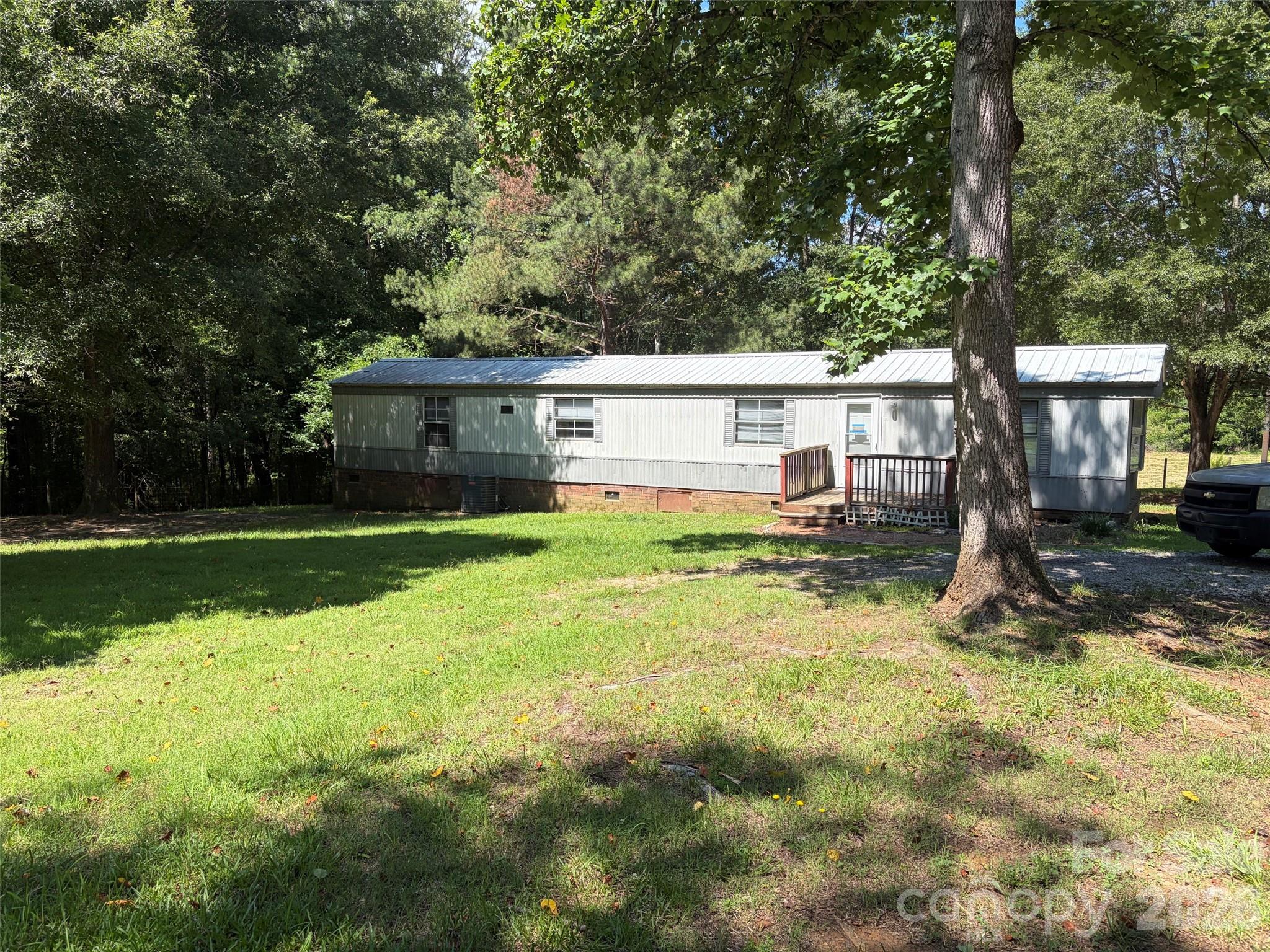 A nice large 7.52 acre lot in Rural setting.  Lot has 2  mobile homes that were remodeled prior to listing for sale. Owner has a solid history of Rental income from these 2  2 bedroom 2 bath Trailers.  Live in one and rent the other to pay the note.