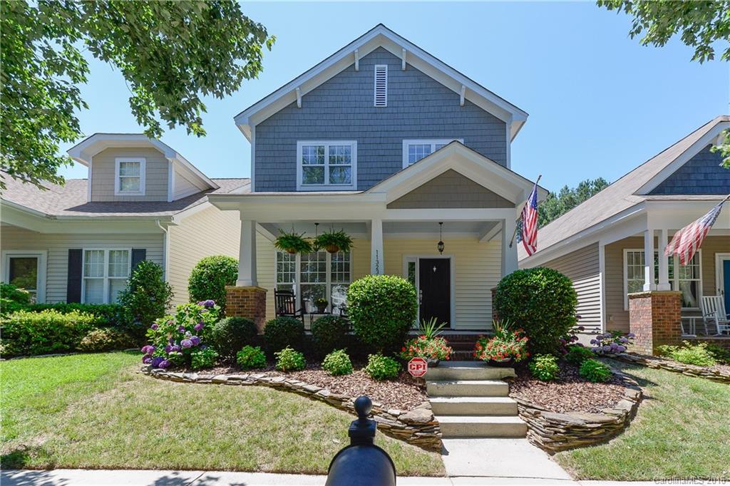 Gorgeous Charleston-style home in established Ballantyne community. Covered rocking chair front porch overlooks quaint tree-lined street.  Move in ready and tastefully updated throughout with Pottery Barn feel.  Kitchen features granite countertops, breakfast bar, stainless steel appliances.  Lovely hardwood floors on main level.  Large master bedroom with en-suite bath plus two additional bedrooms upstairs.  Two-car garage, fenced yard and nice landscaping.  Close to shopping, dining and more!