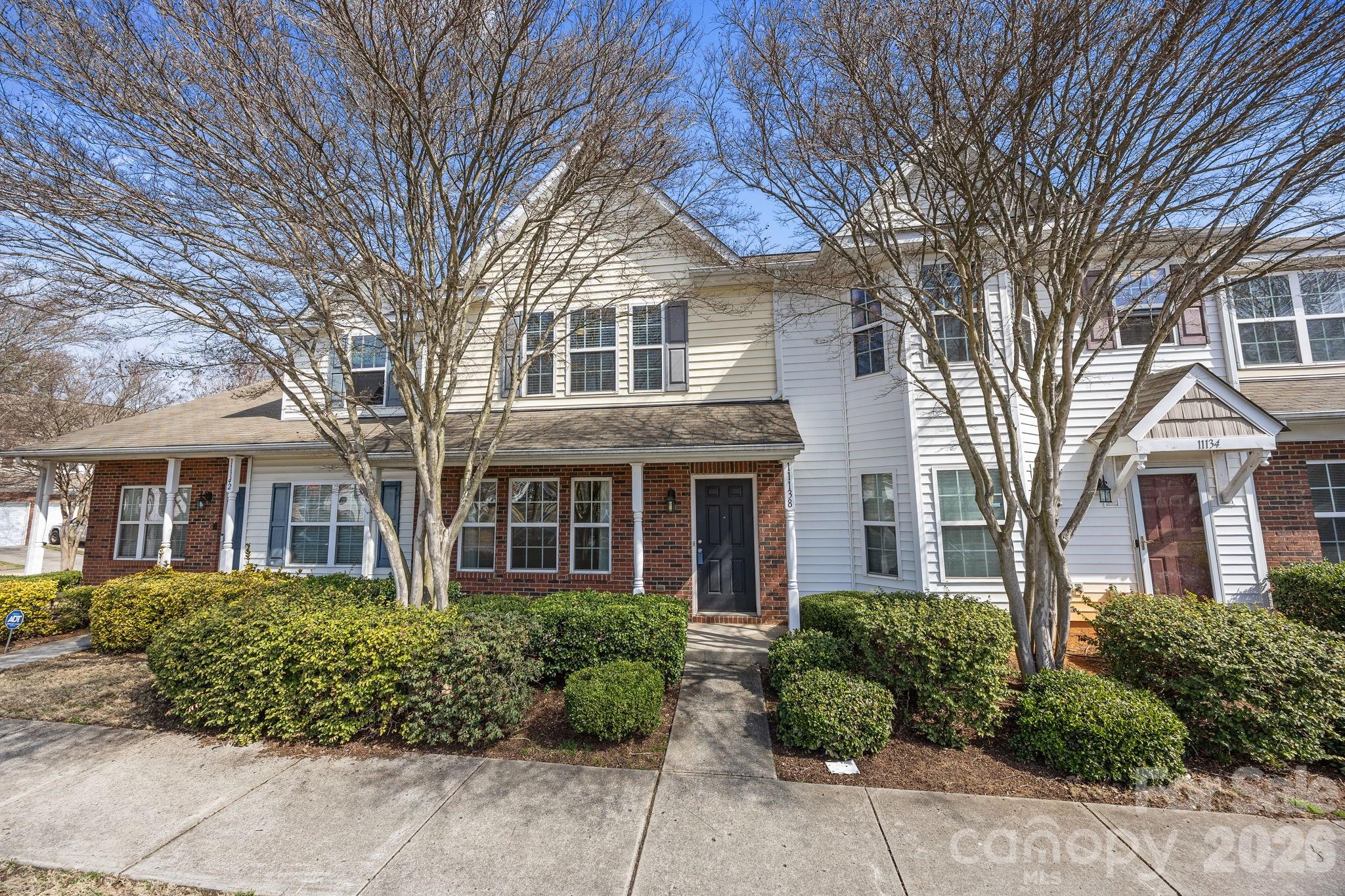 Welcome to this well-maintained townhome in the desirable Villages at Back Creek, conveniently located just minutes from UNCC and easy access to HWY 485. The main level features a spacious living room and dining area, perfect for everyday living or entertaining.  The kitchen offers great functionality with an island, pantry, laundry closet, and a convenient half bathroom on the main floor. Upstairs, you’ll find two spacious ensuite bedrooms, each featuring double vanities and large walk-in closets, providing comfort and privacy for residents or guests.  Step outside to the deck off of the kitchen, complete with a storage closet for added convenience. Residents of the community enjoy access to an outdoor pool, adding to the neighborhood’s appeal. Whether you’re a first-time homebuyer or looking for a solid investment opportunity, this townhome offers both convenience and value in a fantastic location.