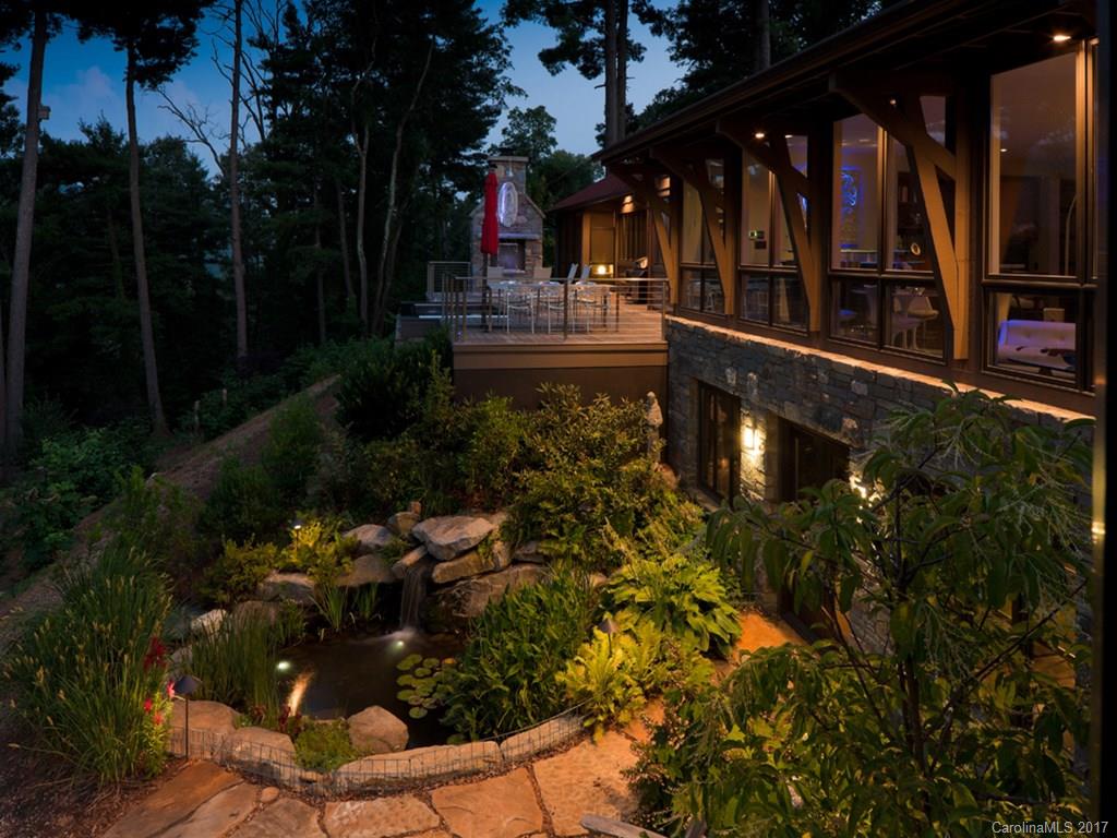 Unique mid century modern (Henry Gaines architect) renovation in a prime Grove Park location.  There is nothing like this, this close to downtown. Escape to your own private oasis in this masterpiece of a remodel. Un-compromised views of Sunset Mountain. Stunning kitchen, three en-suite bedrooms include master with screened porch. Swim/spa on expansive deck. Additional 700 sq ft, detached one bedroom apartment. Extensive landscaping including blueberries, grapes and thousands of perennials.
