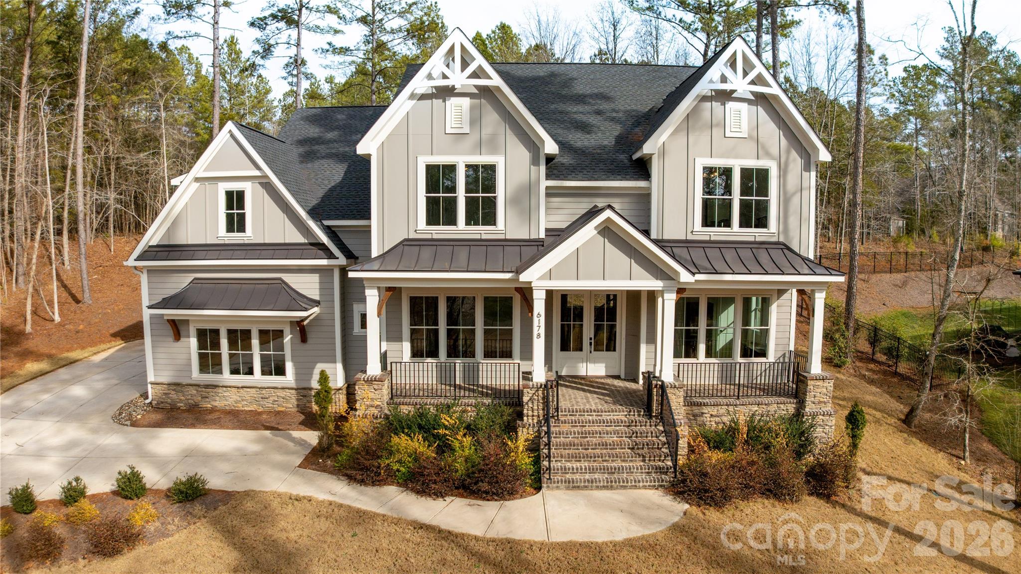 If you’re craving space, quieter mornings, and a home that truly feels like a retreat, this custom-built beauty is exactly what you’ve been waiting for. Here, life moves a little slower and a lot more intentionally. Think open land instead of packed rooftops, fresh air instead of traffic noise, and a place where you and your family can step outside and truly breathe.

Welcome to this exquisite 2023 custom-built home located in the highly sought-after Riverchase Estates, where refined craftsmanship meets resort-style living. The entire home features soaring 10-foot ceilings and elegant 8-foot doors, creating a bright, open, and sophisticated atmosphere throughout.

Brick steps lead to a stunning covered front porch with custom detailing, setting the tone for the elegance found inside. The expansive kitchen is designed for both everyday living and entertaining, offering an oversized island, breakfast area, and generous walk-in pantry that allow for effortless flow and gathering. Solid oak hardwood floors run throughout the home, enhancing its cohesive and upscale aesthetic.

The luxurious primary suite serves as a private retreat, featuring a spa-inspired bath with a tiled frameless glass shower, soaking tub, and two beautifully designed walk-in closets.

Thoughtfully designed with timeless finishes, this home is the perfect blank canvas—ready for someone to add their personal touch and make it truly their own.

Residents enjoy access to a multi-million-dollar amenity center with a resort-style pool, lighted tennis, pickleball, and basketball courts, playground, amphitheater, picnic areas, and a clubhouse featuring a fitness center, lounge, dining spaces, and outdoor fireplaces. Outdoor enthusiasts will also appreciate nearby canoeing and kayaking along the Catawba River.