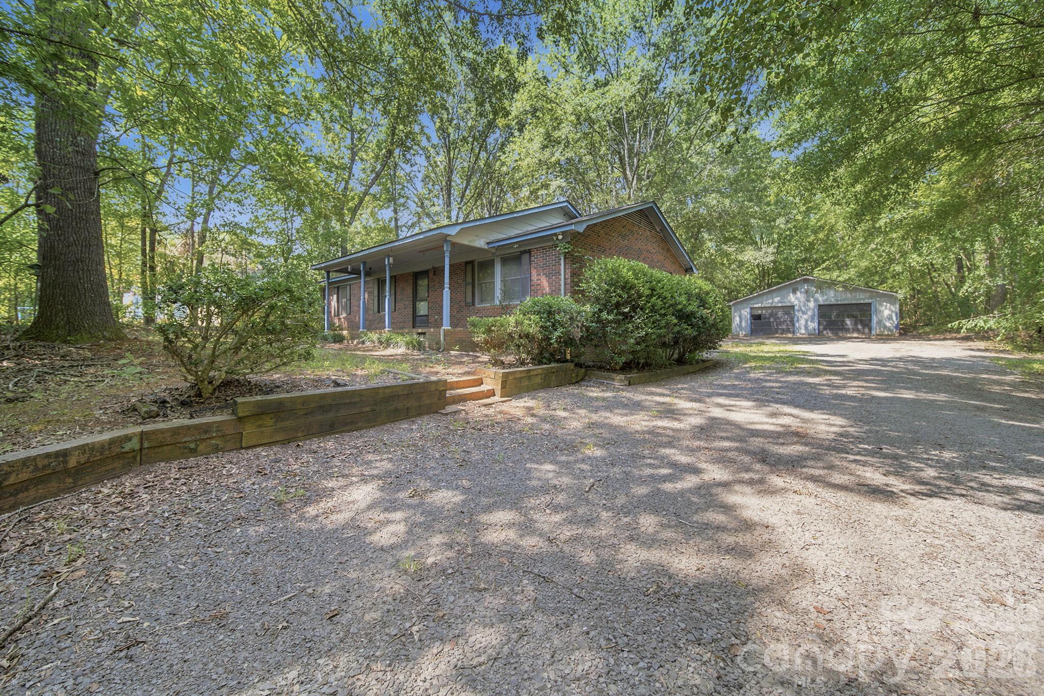 Nestled on a peaceful 1.2-acre wooded lot in Midland, this inviting 3-bedroom, 2-bathroom home offers the perfect blend of privacy, space, and country charm. Surrounded by mature trees, the property provides a tranquil setting while still being conveniently located near local amenities. With just a few repairs and updates, this is an excellent opportunity for buyers looking to add their own style and value. The large 1,460 square foot detached garage can be used for much more than simply parking. Personal work shop, exercise room, entertainment space, transform it however you like.