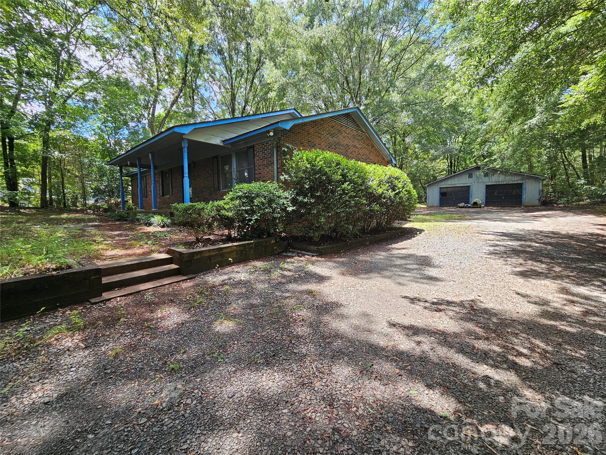Nestled on a peaceful 1.2-acre wooded lot in Midland, this inviting 3-bedroom, 2-bathroom home offers the perfect blend of privacy, space, and country charm. Surrounded by mature trees, the property provides a tranquil setting while still being conveniently located near local amenities. With just a few repairs and updates, this is an excellent opportunity for buyers looking to add their own style and value. The large 1,460 square foot detached garage can be used for much more than simply parking. Personal work shop, exercise room, entertainment space, transform it however you like.