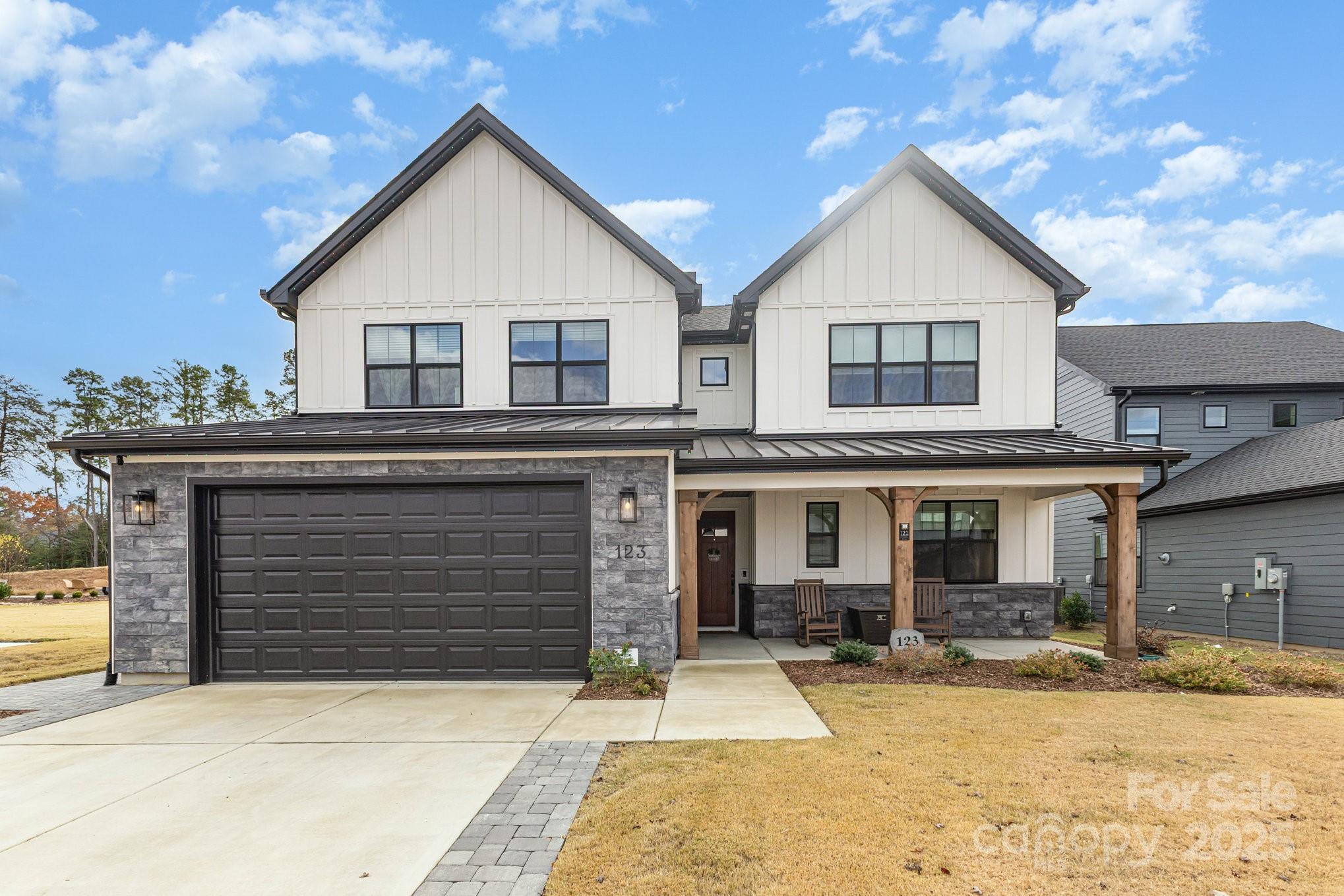 IMMEDIATE EQUITY!  With the reduced price, the new buyer will gain instant equity in the home.  Stunning-like-NEW 2024 custom home in Tega Cay—an entertainer’s dream anchored by a true chef’s kitchen (gas cooktop, wall oven, oversized island, walk-in pantry) that flows into a sun-filled great room with a dramatic floor-to-ceiling tiled fireplace and electronic shades. The main level delivers TWO versatile flex rooms plus a private guest suite; upstairs, a large bonus/media room remains theater-configured yet bright with windows—perfect for movies, gaming, play, studio, or another office. Upgrades made after purchase include an office library with ladder, tiled fireplace surround, added cabinetry, a custom pantry, and more. Outdoor living shines with a screened porch opening to an expanded paver patio with seating wall, permanent holiday lighting, and a fully fenced backyard—ideal for gatherings. Tech-forward and fast: Active with Google Fiber 8gbps  plus upgraded CAT6A hard-wired networking for smooth WFH, streaming, and gaming. Five bedrooms, 4.5 baths, generous storage, and a level homesite—move-in-ready luxury that balances everyday function with fun.