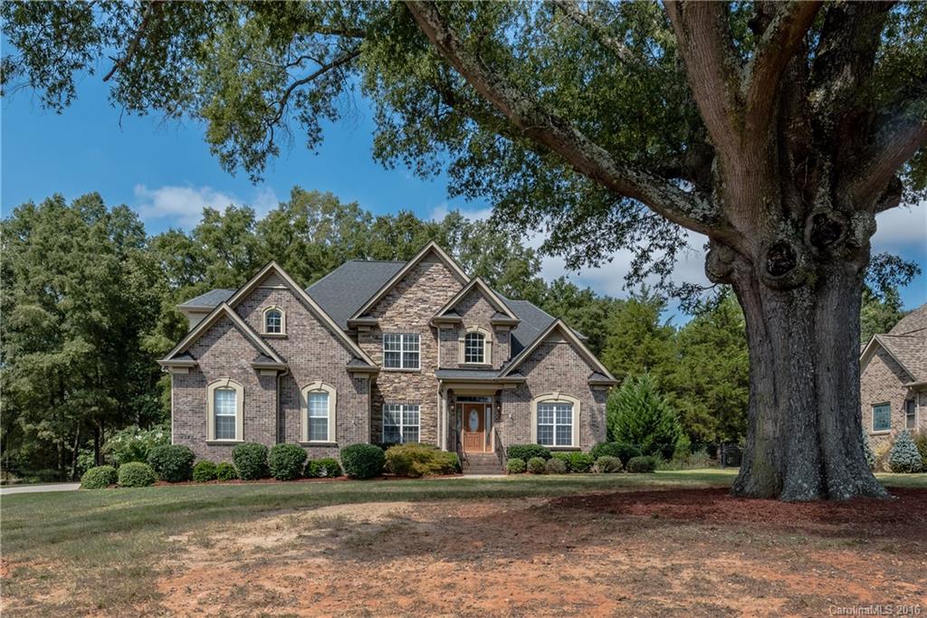 Custom full brick home with classic elegance and timeless details. From first glance this one-owner home echoes spacious, open, flowing. The wide open floor plan, spacious great room, large cook's kitchen, formal dining room, and TWO recreation rooms are perfect for both large scale and more intimate gatherings. Private, park-like back yard and custom stone patio extend the home's living/entertaining space. Lots of hardwoods, mill work, and many other touches you find only in a custom home.
