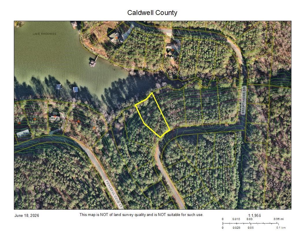 Discover your perfect retreat on this serene waterfront lot nestled in a protected cove on Lake Rhodhiss, where tranquility meets convenience. Situated within the charming Broadwater Landing community, this property offers a peaceful setting without the restrictions of an HOA and comes with all essential utilities already in place, including water, sewer, electricity, natural gas, and high-speed internet. While dock installation is not permitted in this calm cove, the location remains ideal for swimming, kayaking, and paddle boarding right from the shore. Lake Rhodhiss itself is a hub for endless recreation, catering to enthusiasts of fishing, boating, water skiing, wakeboarding, canoeing, and more. Beyond the water's edge, you are just moments away from a full range of nearby amenities, making everyday life effortless with easy access to shopping, dining, and medical facilities.