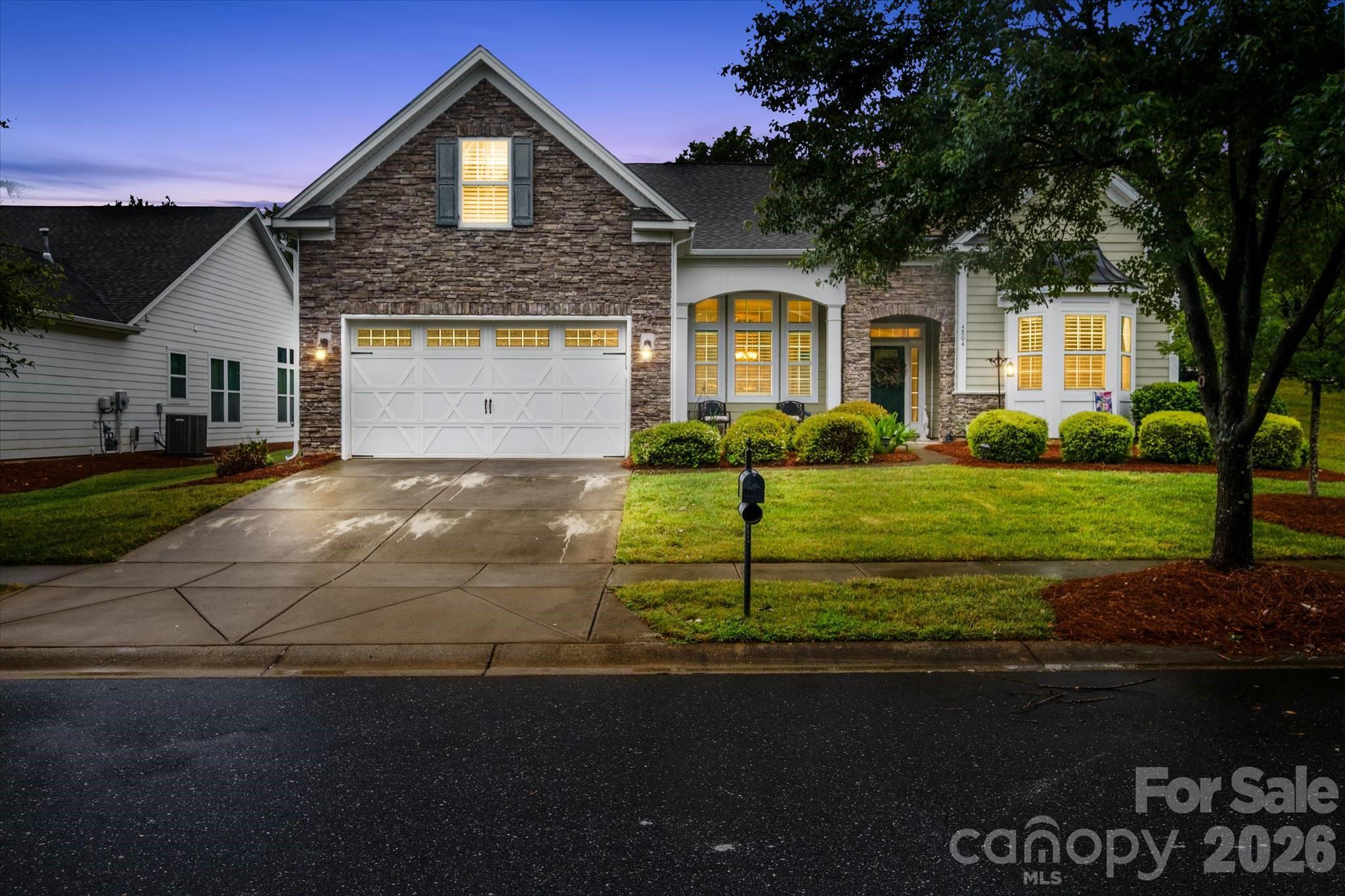 Welcome to 4804 Star Hill Lane in the highly sought-after The Vineyards on Lake Wylie! This beautifully maintained 4-bedroom, 2-bath home offers a spacious 1.5-story floor plan designed for both everyday living and entertaining. The open-concept layout is filled with natural light and features a cozy stone fireplace, creating a warm and inviting atmosphere.

The well-appointed kitchen boasts under-cabinet lighting and flows seamlessly into the living and dining areas. The primary suite is conveniently located on the main level, while additional bedrooms provide flexibility for family, guests, or hobbies. A dedicated home office includes built-in bookshelves that convey with the home. Hardwood and carpet tile flooring span the main level, with carpet only on the stairs and upstairs bedroom.

Enjoy year-round relaxation in the heated and air-conditioned enclosed porch, or gather with friends around the built-in gas firepit on the patio. The finished garage offers ample storage, and the chair lift can remain or be removed at the seller's discretion.

Situated on a .26-acre lot, this home includes lawn maintenance, Spectrum cable and internet, trash and recycling, and access to the exceptional amenities of The Vineyards on Lake Wylie. Residents enjoy two community pools, including a Junior Olympic-sized pool, a private boat ramp and kayak launch, tennis, pickleball and bocce ball courts, two dog parks, playgrounds, and a resort-style lakefront clubhouse. Conveniently located just minutes from Lake Wylie, shopping, dining, and Uptown Charlotte, this home offers the perfect blend of luxury, convenience, and low-maintenance living.

Situated on approximately 0.26 acres in the desirable Vineyards on Lake Wylie community. Hoa includes Spectrum cable/interent, Lawn maintenance, trash/recycling, 2 community pools (including a Junior Olympic-sized pool),Private boat ramp & kayak launch, Tennis, pickleball & bocce ball courts, 2 dog parks + playground. Resort-style, lakefront community living this property offers a peaceful neighborhood setting with convenient access to shopping, dining, schools, and major commuter routes. Enjoy the perfect balance of suburban tranquility and city convenience, all just minutes from Lake Wylie and Charlotte's many amenities.