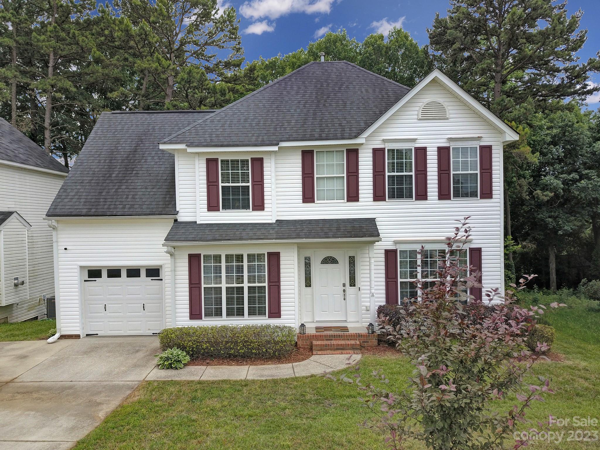 Get the feels as you pull in the driveway & see the mature landscaping leading you up the sidewalk to the front porch. Step through the front door to find beautiful, gleaming hardwoods & bright colors throughout the main level. The cozy living room has a gas fireplace & plenty of space. You'll also find the formal dining room, powder room, kitchen (w/ gas stove), walk-in pantry, & breakfast nook. Head upstairs to find another full bathroom in the hallway, 3 bedrooms, including the primary w/ an ensuite & walk-in closet. You'll also be surprised to find a bonus room which is ideal for an office or flex room. The spacious, fenced in backyard backs up to the woods and features a large deck, perfect for outdoor gatherings. There are also a couple of planter boxes ready for the next gardener. Located in the heart of Rock Hill, close to schools, shopping, restaurants, minutes from downtown and convenient to I-77.