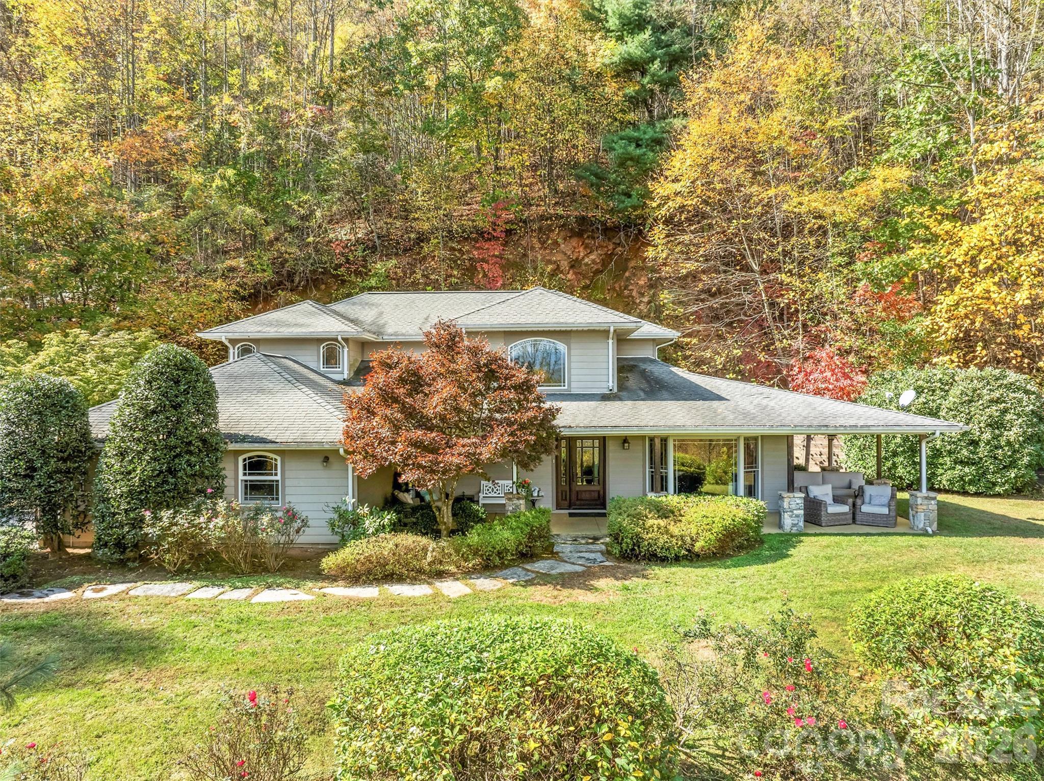 Motivated Seller! Escape to Sky View, your own slice of paradise in this stunning home nestled in the breathtaking Smoky Mountains and spanning 13 acres of pristine land, This exquisite property offers long range mountain views and a sanctuary of privacy that truly elevates the meaning of a retreat. Step inside through the grand entry and be captivated by the fine elements of the home.  Enjoy the large kitchen ideal for culinary creations, flowing into the sunny breakfast area and a formal dining area The living room and family room share a lovely 2 sided fireplace. Plenty of space for entertaining family and friends.  The main level primary suite, complete with ensuite makes main level living easy. On the upper level you will find 2 additional bedrooms, a bonus/guest room and a full bathroom.  Surrounded by nature's beauty, you can enjoy the tranquility of mountain living without any restrictions, making this property a rare find. Two additional building lots. A Don’t miss the chance to own this exceptional residence or vacation rental that combines luxury with the allure of the majestic Smoky Mountains. Located just minutes to Bryson City, Cherokee Harrah's Casino and the Great Smoky Mountains National Park. Embrace the lifestyle you deserve!
