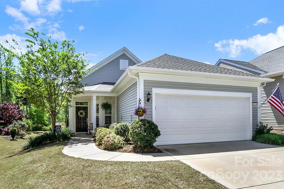 Cozy Pine Spring home in the amenity-rich Sun City Carolina Lakes! At the front of the home is an office that can be used as a home office or hobby room. The open great room with crown molding is filled with natural light & flows directly from the foyer into the dining area. The kitchen has granite counters, tile backsplash, stainless steel appliances & a breakfast nook with 3 windows overlooking the backyard. The primary suite is at the rear of the home and has an ensuite bathroom with a dual sink vanity, glass enclosed shower, & a spacious walk-in closet. A guest bedroom with access to a full hallway bath is great for hosting out of town guests! Enjoy your morning coffee or read a book while sitting on the covered back patio that is extended and has stamped concrete flooring & a ceiling fan! The 2-car, extended garage features fixed stairs that lead up to the spacious attic. Don't wait- come be a part of the active-adult lifestyle and enjoy the countless amenities!