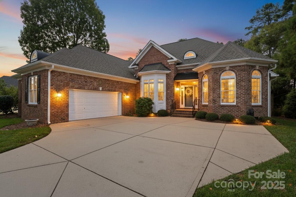 ALL THE COMFORT OF ONE LEVEL LIVING WITH THE LUXURY OF OPEN SPACIOUSNESS! This stunning, all-brick home on Waterford's 14th hole is ready for you to move in.  Loaded with brand NEW main level wood flooring, NEW roof (2023), and NEW Trane HVAC (2024). One story living at its best with a private guest room and full bath upstairs. The large, well designed kitchen features plenty of cabinets, classic granite counter tops, with a large brekafast bar for seating, and a bright area for a casual kitchen table. The kitchen easily flows into the formal dining room with plenty of room for large gatherings. Enjoy the newly painted, inviting living room with a gas log fireplace, or hang out in the flex/bonus room, which offers plenty of space and floor support for a pool table.  The luxurious main level Primary Suite is a true retreat with the bath featuring double vanities, tub for soaking, a separate toilet closet, and two walk-in closets. The split-bedroom floor plan includes 2 additional bedrooms on the first floor with a full bath , placed opposite side of home from the primary suite. A light-filled study/office is on the main level. Upstairs is a 4th bedroom with its own private bath. Main level laundry room with sink and cabinets. Outdoor living is exceptional with a cozy, private screened in porch, spacious deck, and patio all overlooking the golf course. Relax and take it the peaceful beauty of nature as you watch songbirds in the wooded area behind the home, or enjoy the view of golf carts along the fairway and the pond in the distance. Golf course living at it's best with no membership requirement!  A spacious, over-sized 2-car garage with room for a golf cart is an added bonus! Walk-in attic storage. Irrigation system. Highly desirable neighborhood with pool, sidewalks, streetlamps, and low HOA. You can't beat this location! Minutes to I77, quick commute to Charlotte, and minutes from Rock Hill's premier shopping, dining, and Old Town. Don't miss this one!