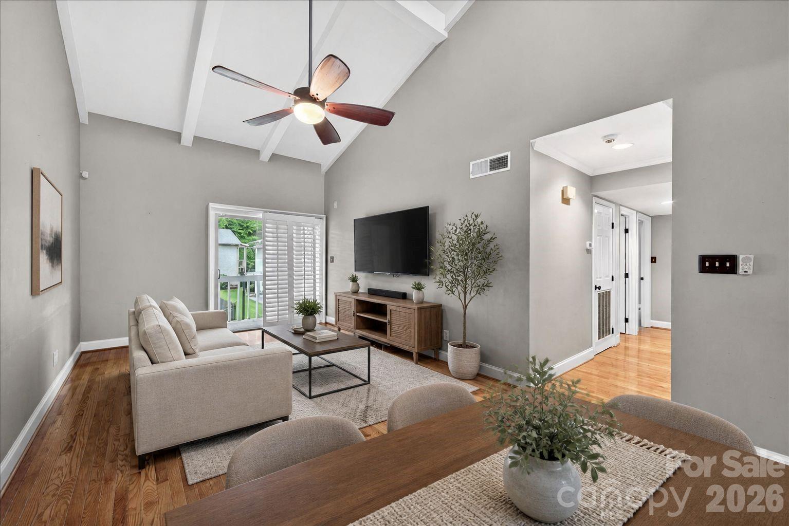 Completely remodeled condo featuring an upgraded kitchen with beautiful high-end wood cabinetry, granite countertops, stainless steel appliances, and recessed lighting. The home offers real hardwood floors in excellent condition and vaulted ceilings in the living room, creating an open and airy feel. Additional upgrades include custom closets throughout, updated bathrooms, and plantation shutters. Enjoy pool views from the private exterior balcony. Conveniently located directly across from Atrium Health Cabarrus and just minutes from Carolina Mall, I-85, shopping, and dining. An assigned parking space conveys with the property, along with ample visitor parking. Refrigerator, washer, and dryer will also convey.