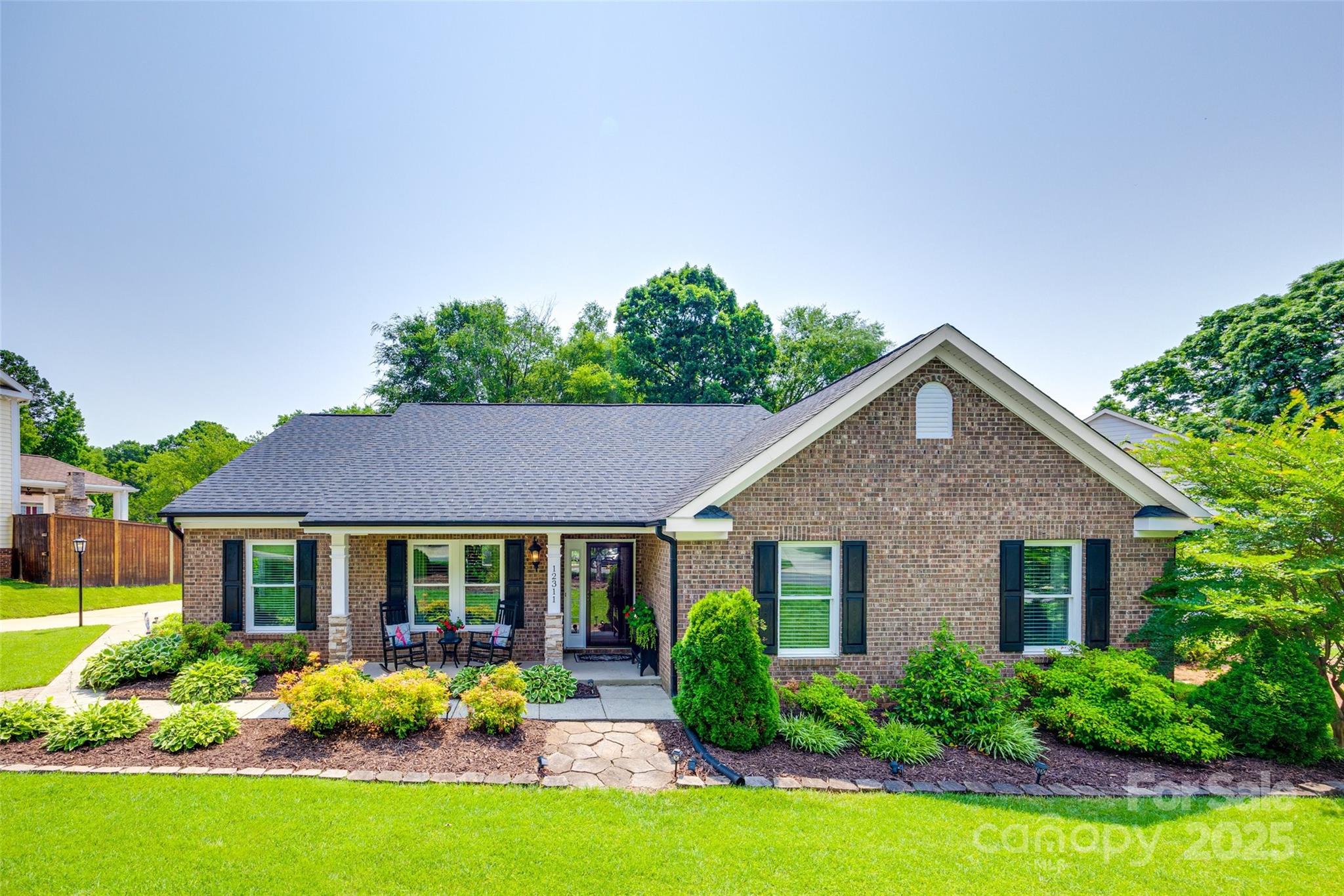 **MULTIPLE OFFERS--HIGHEST & BEST OFFERS BY SAT. 6/7 at 10AM**  Move-in ready and made for entertaining! Beautifully updated 4-bedroom ranch with fresh neutral paint, new carpet, wood flooring, and new crown & base moldings to top it all off!  Features include a spacious living room with a cozy fireplace and transom-topped windows, while the dining room impresses with a 12’ ceiling. Bright white kitchen complete with granite counters, tile backsplash, stainless appliances, gas range, working island, and coffee bar. The 4th bedroom is an ideal home office. The primary suite offers private access to outdoor living and a spa-like bath with a soaking tub and a large walk-in shower w/ frameless glass enclosure. Secondary bath includes an oversized tiled shower with a bench. Outdoor living is truly exceptional with an extra-large screened porch, multi-level paver patio, grilling station, and pergola—set in a beautifully landscaped yard. This is a must see!