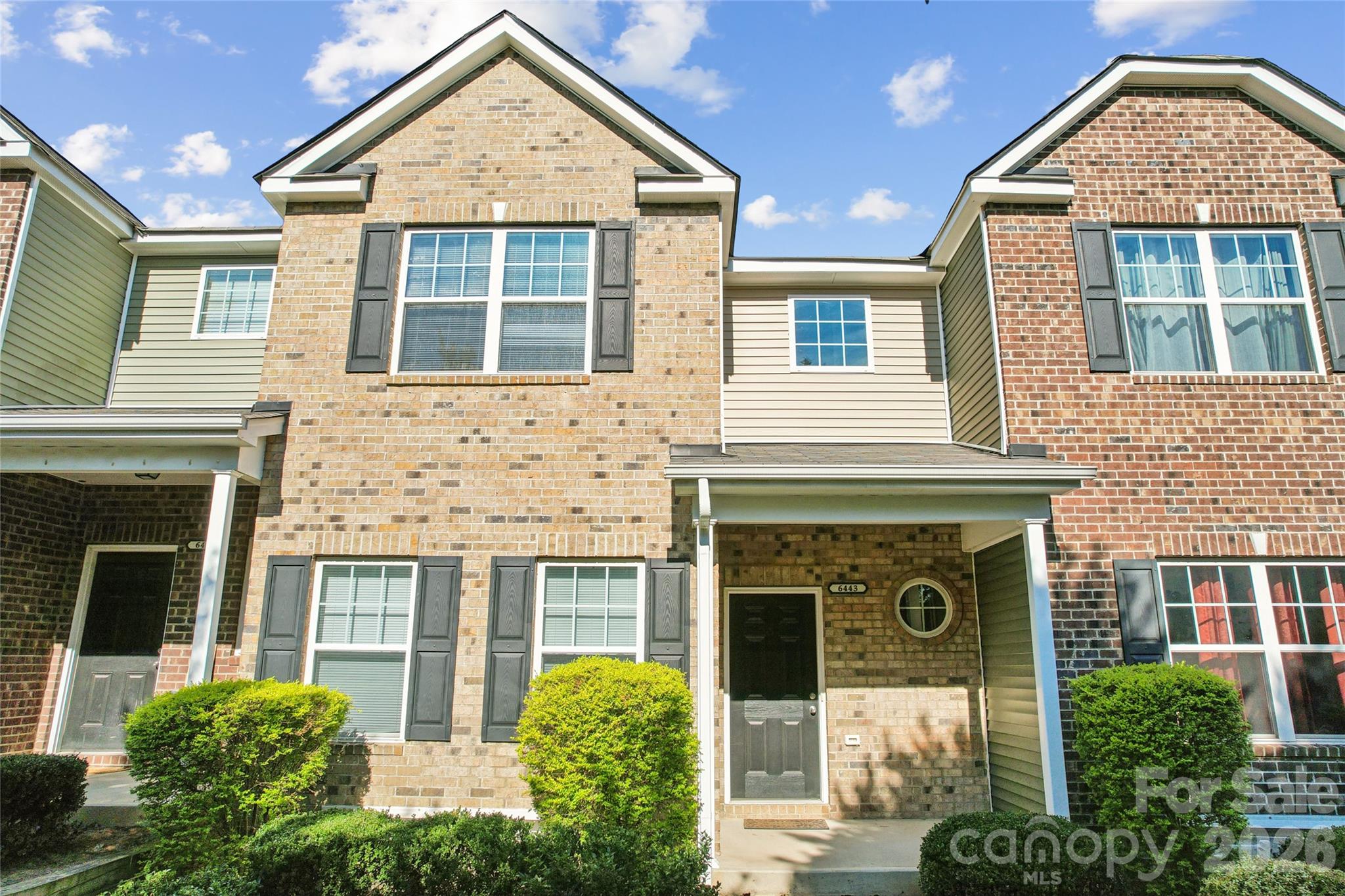 Incredible investment opportunity! 5 bedrooms with 4 full baths 2 story w/ Basement townhome conveniently located near shops and restaurants in a community that offers an outdoor pool.  Being 10 minutes from UNCC, makes this 3 story townhome ideal for students wanting to share living space.  The main floor has an updated kitchen with granite countertops, backsplash and new LG stainless steel appliances.  The living room has a gas fireplace and entrance to a relaxing balcony.  There is a bedroom on the main floor with a full bath/powder room.  The lower floor has a 2-car garage.  As you enter from the garage, you will find a bedroom with its own full bath with lots of privacy.  The upper floor has 3 bedrooms including the primary bedroom and 2 full baths.  The primary bedroom has walk-in closets and the primary bathroom has double vanities with separate garden tub and shower.  All the bedrooms are spacious.  The laundry closet is on the upper floor.  Water and sewer are included in the HOA fees.  2019 heating and cooling systems and 2018 roof.  2019 Whirlpool washer and dryer to convey.  The community offers an outdoor POOL to cool down on the summer days, a GYM and a CLUBHOUSE.  It is walking distance from shops and restaurants and minutes from Hwy I-77, 485, I-85 and Uptown Charlotte.  This townhome is ready for its new owners,  it has been freshly painted and new carpet was installed.  Come see this wonderful opportunity!