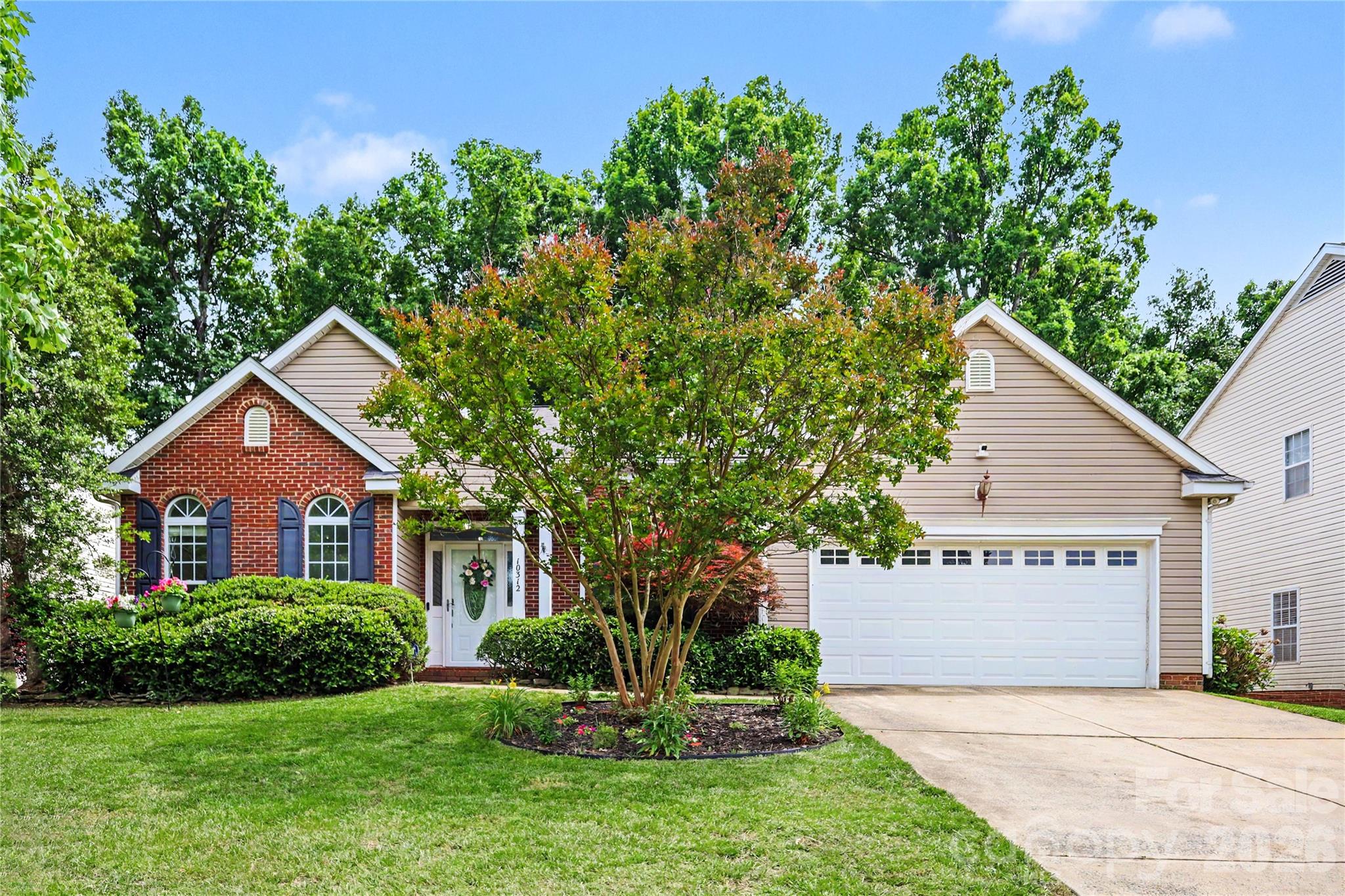 Welcome to one of North Charlotte's most sought after communities. This beautiful, spacious 4 bedroom 2 bathroom one story ranch home in the Villages of Leacroft is move in ready and a perfect place to relax, entertain and create lasting memories.

Step inside to find new chandeliers and rich hardwood floors throughout. The front of the home offers a flex room and formal dining room, both ideal for a home office, hosting guests or quiet relaxation.

The foyer leads you into the heart of the home. The fully updated open concept kitchen features brand new cabinetry, sparkling quartz countertops, a new dishwasher and peninsula seating. Surrounded by windows and adorned with two gorgeous chandeliers, the bright breakfast area overlooks the spacious family room.

The family room brings it all together with another elegant chandelier, a cozy fireplace and a mounted Samsung TV perfect for movie nights or watching the big game. Large windows fill the space with natural light and bring the beauty of the outdoors inside. Double French doors lead from the family room to the backyard patio, creating the perfect setting for relaxing or entertaining in the privacy of the large  fenced backyard.

The luxurious primary suite features a large soaking tub and a custom designed closet with exceptional storage. Three additional bedrooms and a full bath continue down the hallway with elegant lighting throughout.

Additional highlights include a Samsung smart refrigerator, washer and dryer, WiFi thermostat and top security features. Less than 10 minutes from Tradition and Highland Creek Golf Course. Close to I-85, I-485, Concord Mills, Publix, Trader Joes, shopping, trails and parks.
