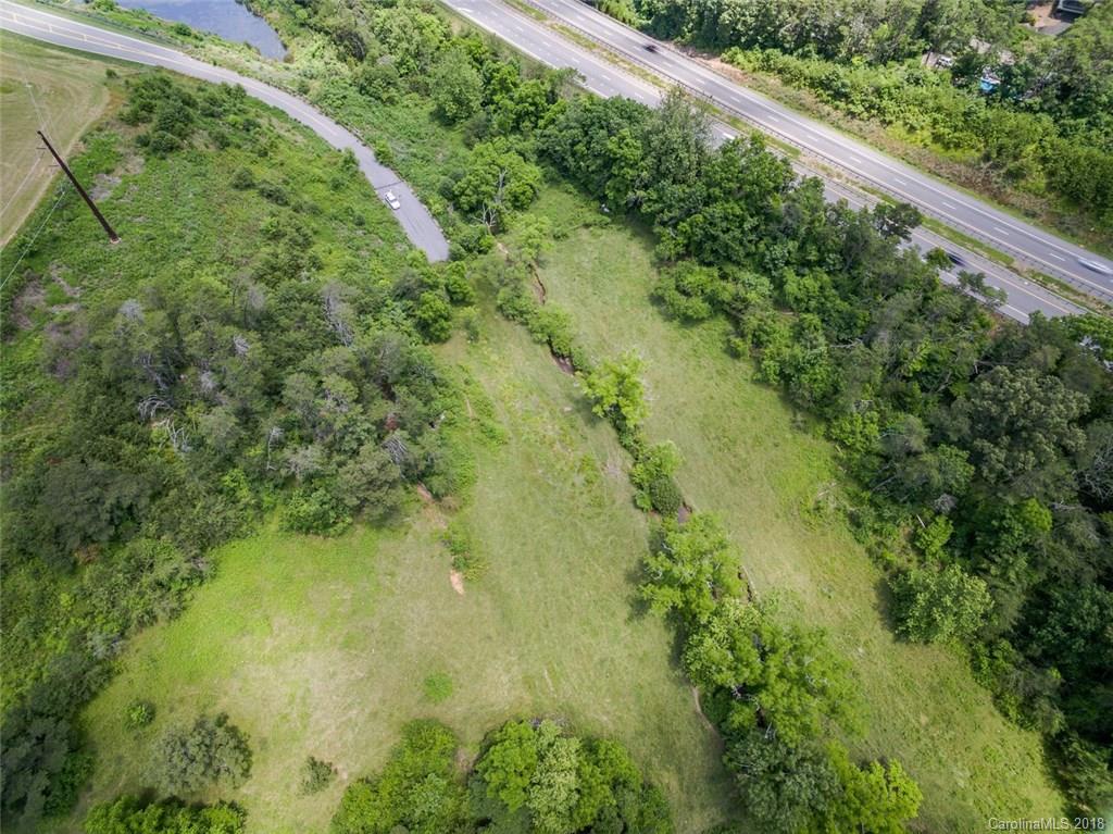 9.4 acres in a thriving commercial area. Deeded paved and curbed right of way through the newly developed Northridge Commons. Lowes, Walmart, Dollar Tree, and other big names share this road and site. New retailers including Hobby Lobby and Marshalls are coming soon, bringing more vehicle and foot traffic to the area. Property would be perfect for multi-family or commercial development. Interstate frontage, city water and sewer and easy laying land makes this a great piece! Also listed in MLS # 3478002.