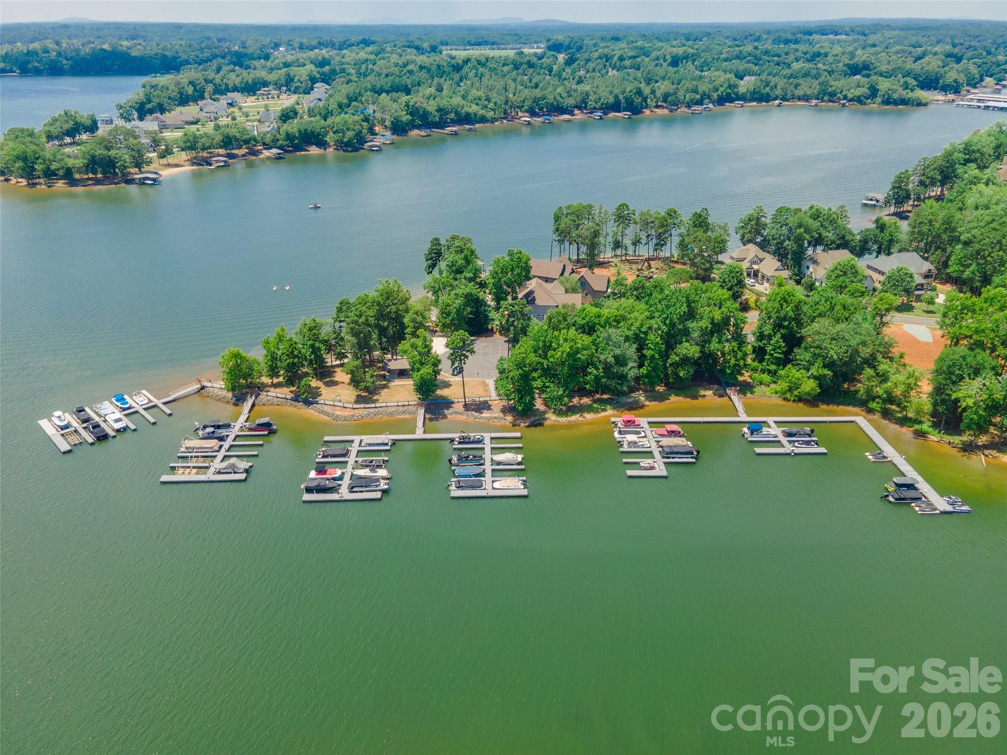 Great lot ready to build your dream home in wonderful gated community! This basement lot is gradually-sloping, private and wooded with a pond view. Within walking distance to the Clubhouse, Outdoor pool, and RV/Boat storage. Reflection Pointe offers the finest resort style living. Over 20 ponds throughout the community, Lake Wylie Access, Waterfront Pavillion, Outdoor Pool and Splash Pad, Clubhouse, Playground, Marina with deeded boat slips, Sports Courts & Walking trails by the lake shore. A quick 10 minute drive to charming downtown Belmont, known for their breweries, restaurants, and local shopping. Convenient to Charlotte Douglas Airport, Charlotte, 485 & I-77.