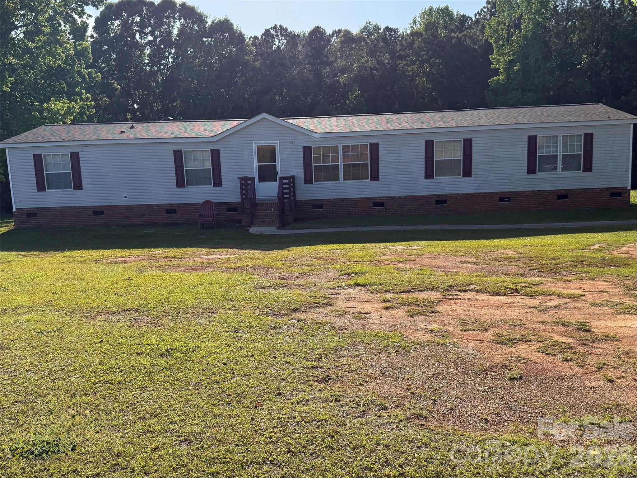 Built in 2002, this spacious four bedroom double-wide sits on 1 acre in Ansonville. Inside, you'll find multiple living and sitting areas, generous bedroom space and a peaceful outdoor setting perfect for relaxing or entertaining. Come see everything this beautiful property has to offer!