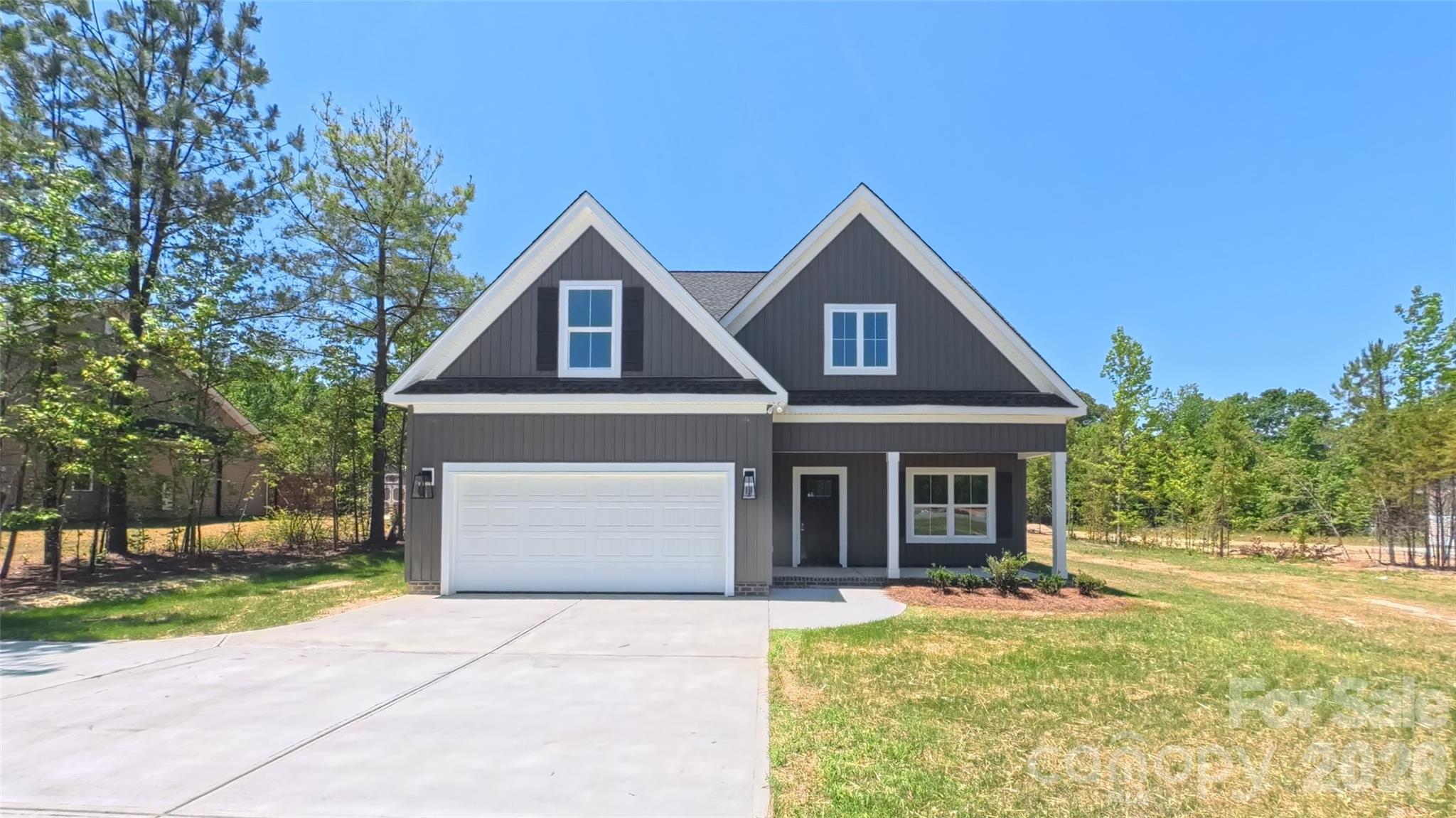 Nestled on an acre in Stonecrest Meadows, this beautiful 2-story home offers 2712 square feet of space and charm you've been looking for! Featuring 4 bedrooms and 3.5 bathrooms, this home provides plenty of room for entertaining, relaxing, and everyday life. Enjoy the privacy of a 1.01 acre homesite while still being conveniently located near everything Clover has to offer. Tankless gas hot water heater and high energy-efficient heat pump (14 seer rating). Comes pre-wired for easy access to Comporium's and AT&T's high-speed Internet. Step outside to unwind on the covered front and rear porches. The home also boasts a 2-car garage and attractive interior layout. Enjoy the cost-saving benefit of water from a private well, eliminating expensive water bills. No sewer bills to pay either! Don't miss the opportunity to make this gorgeous property your next home!